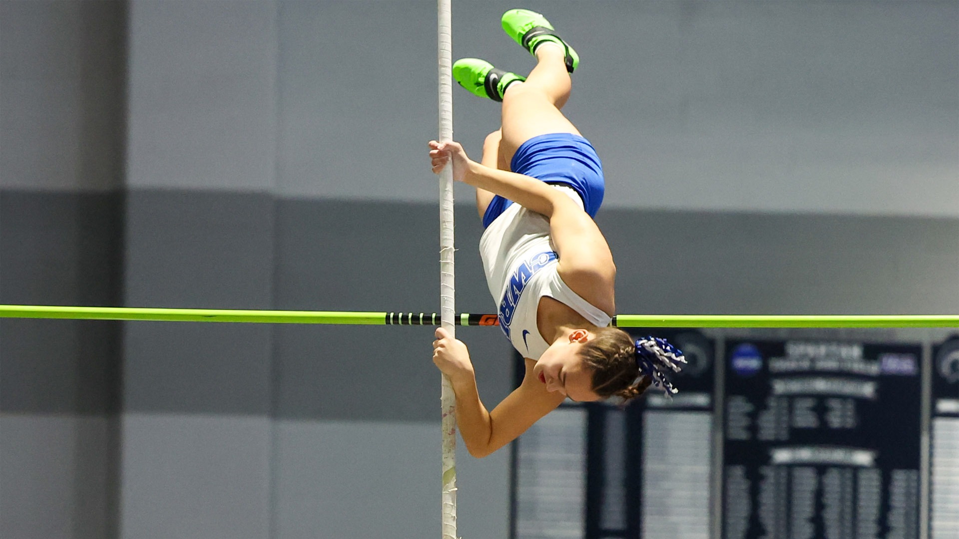 Anna Callo clearing the pole vault bar 