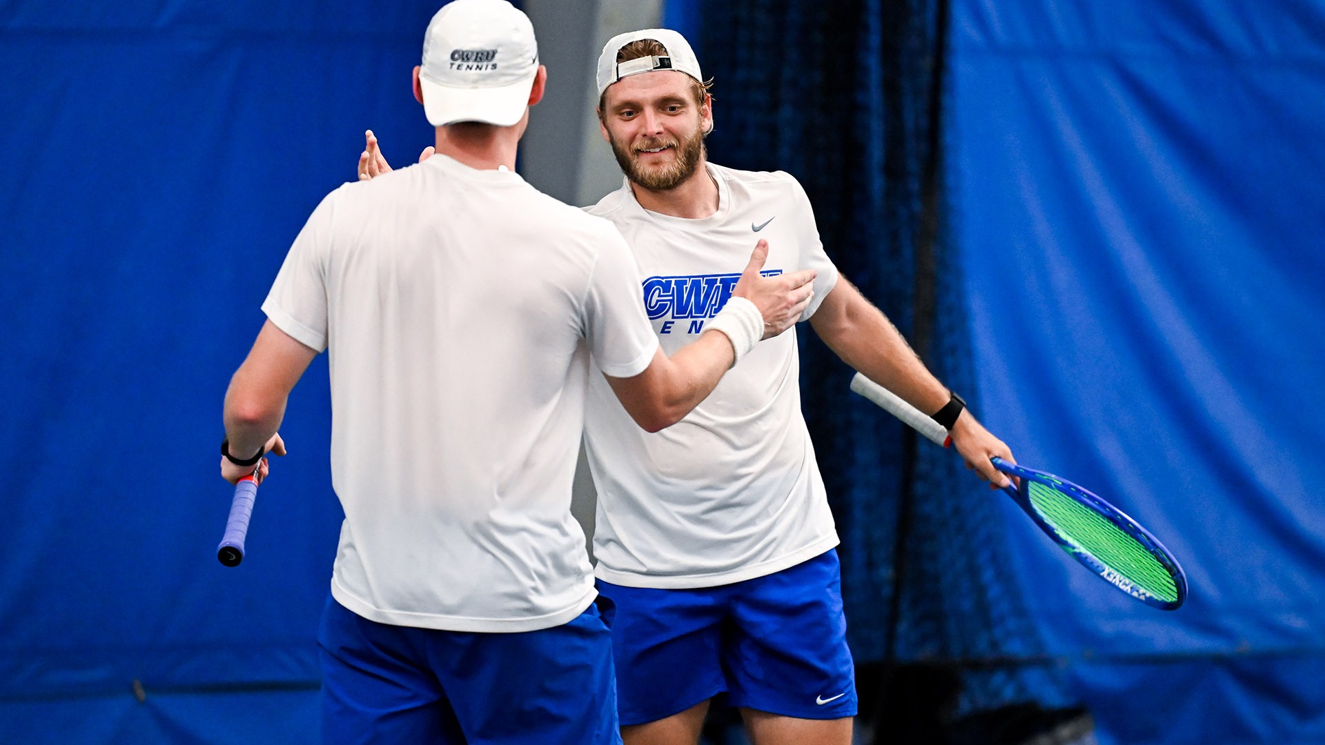 Bryce Ware celebrating a point with Trey Lambright during the NCAA Doubles Tournament