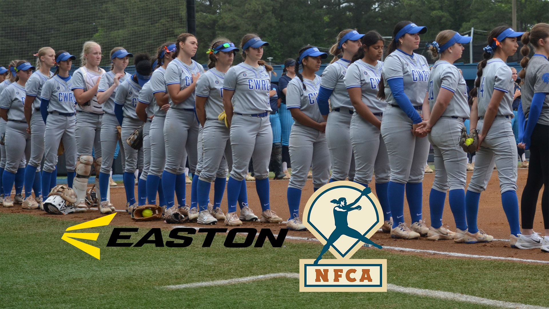 CWRU softball team standing for the national anthem against Virginia Wesleyan with the NFCA and Easton logos bottom center