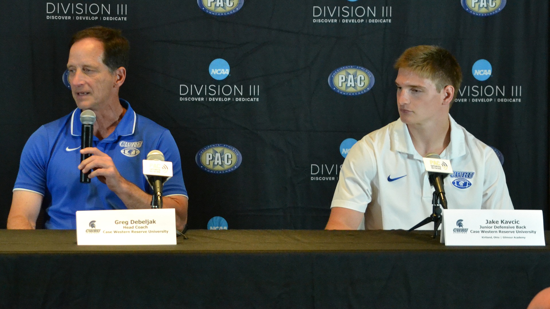 Head Coach Greg Debeljak (left) and junior defensive back Jake Kavcic (right) speaking at 2026 PAC Media Day