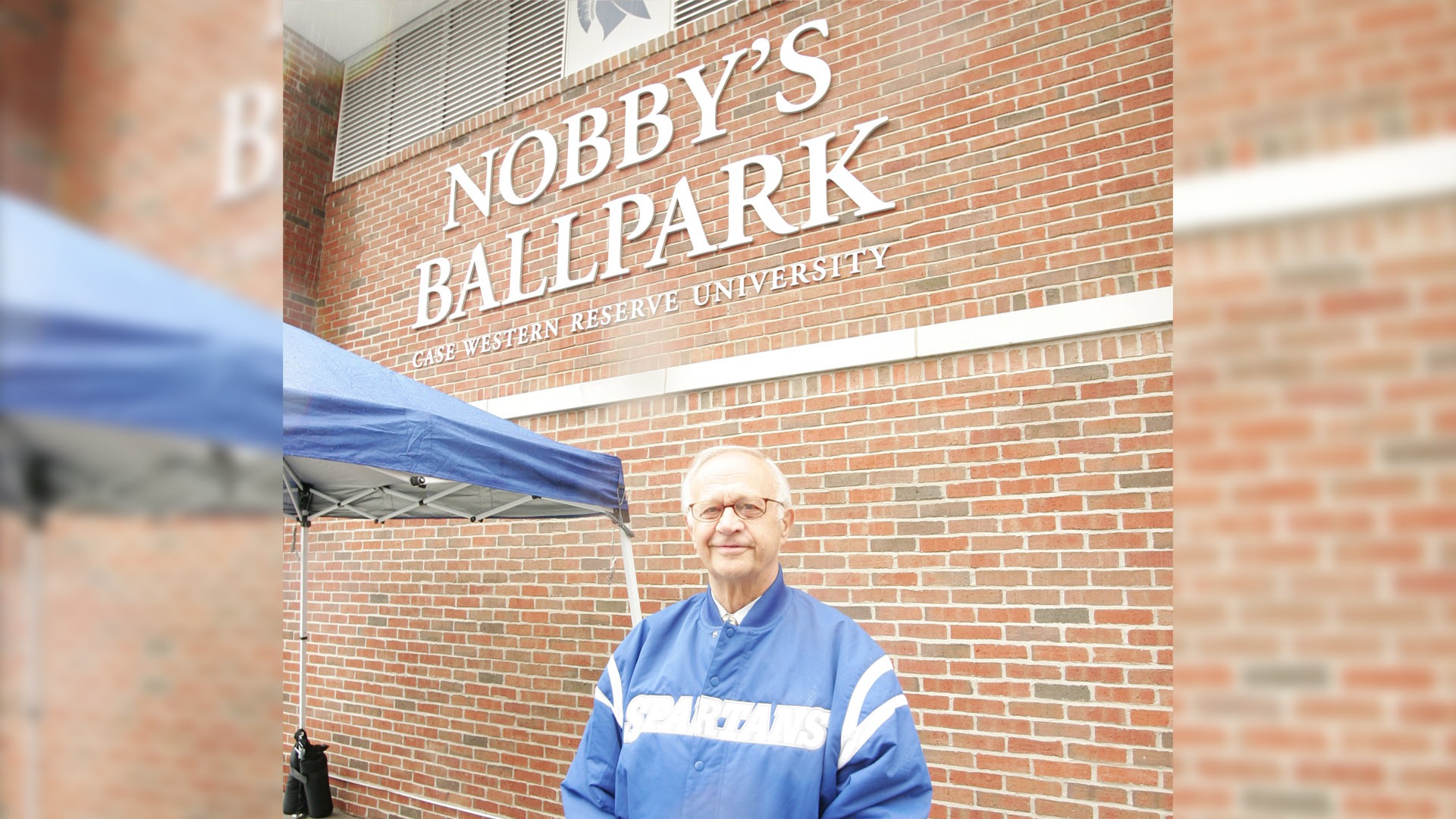 Nobby Lewandowski standing in front of Nobby's Ballpark