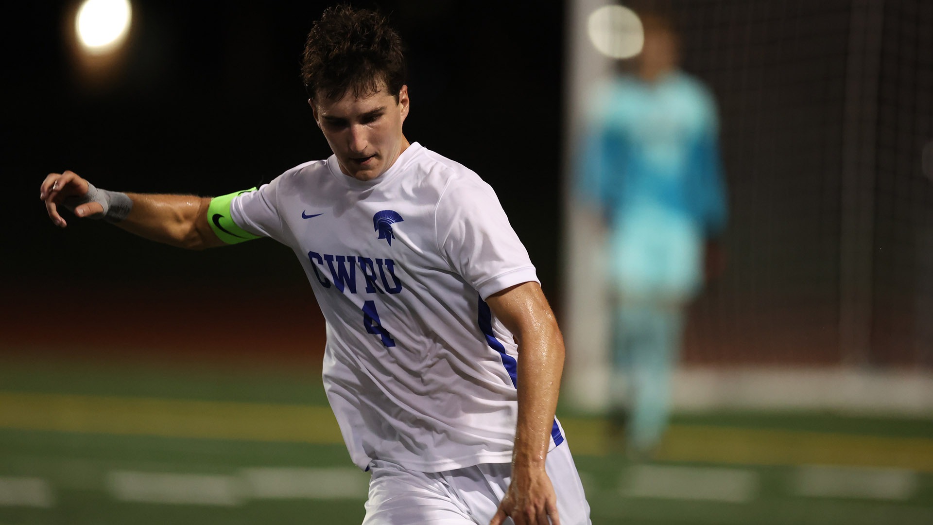 Cormac Apostolides taking a shot against Ohio Wesleyan