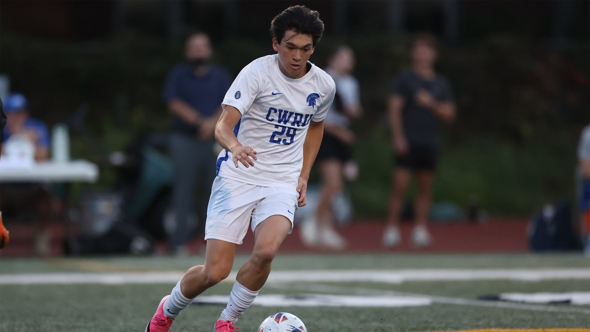 Ashton McNally dribbling the soccer ball against OWU