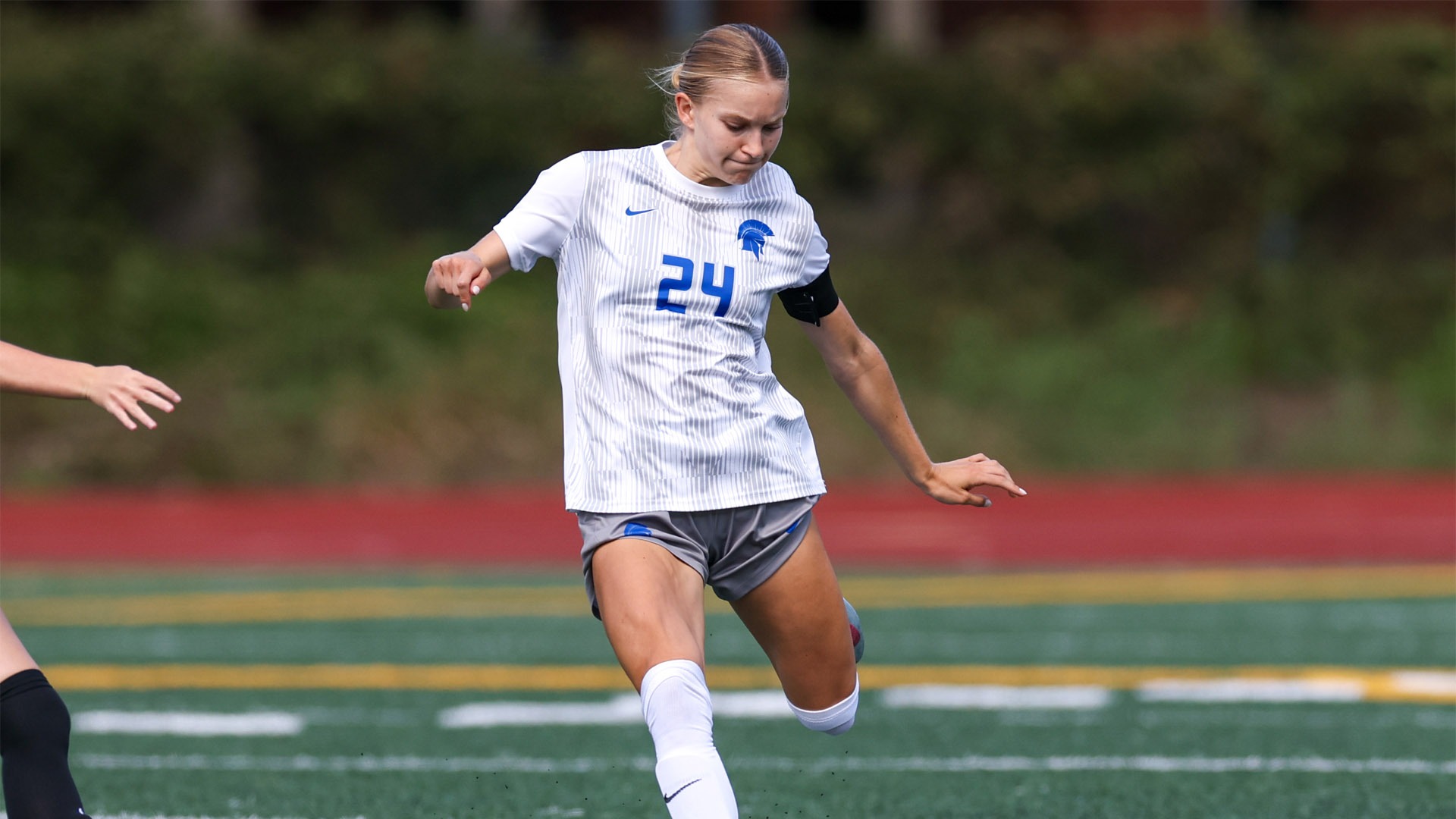Kat Tsarouhas about to kick the ball with her left foot