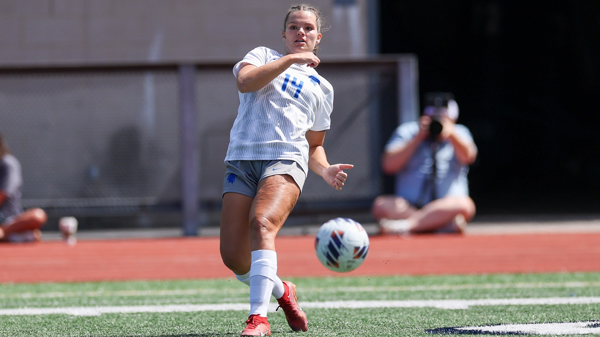 Maya Healy kicks the soccer ball against Capital