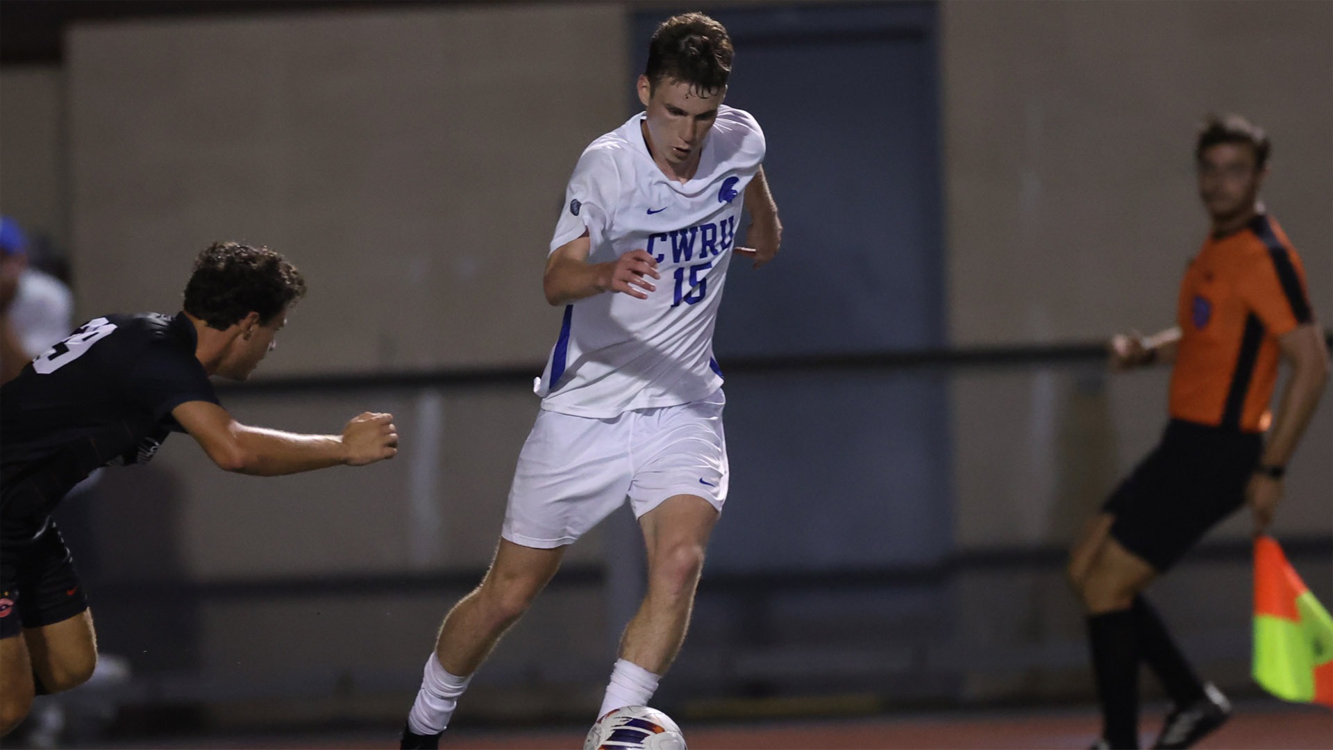 Mitchell Fein trying to get past two defenders