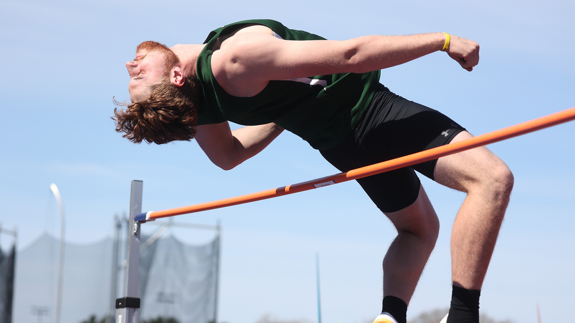 Carter Mackey leaping over the high jump bar at LEC's
