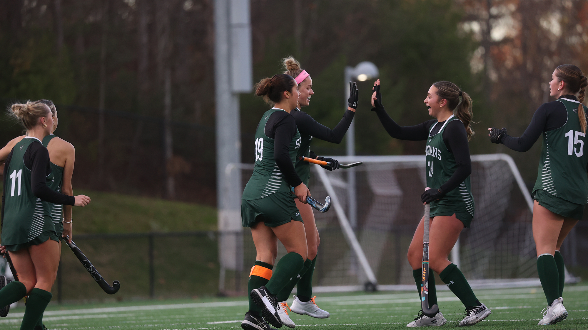 Spartan Field Hockey team gives high fives after a goal