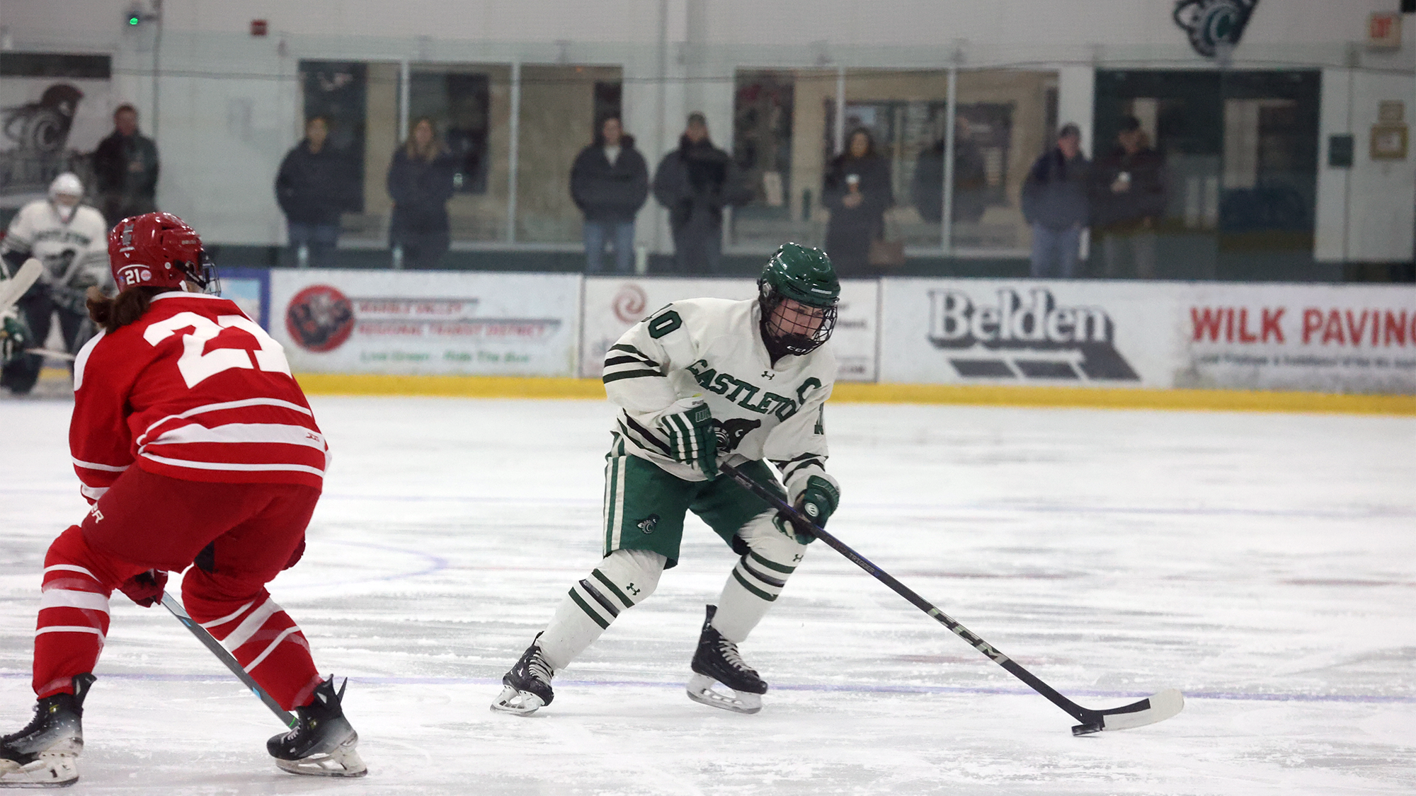 Moa Carlsson (R) skates past Cortland defender heading into offensive zone