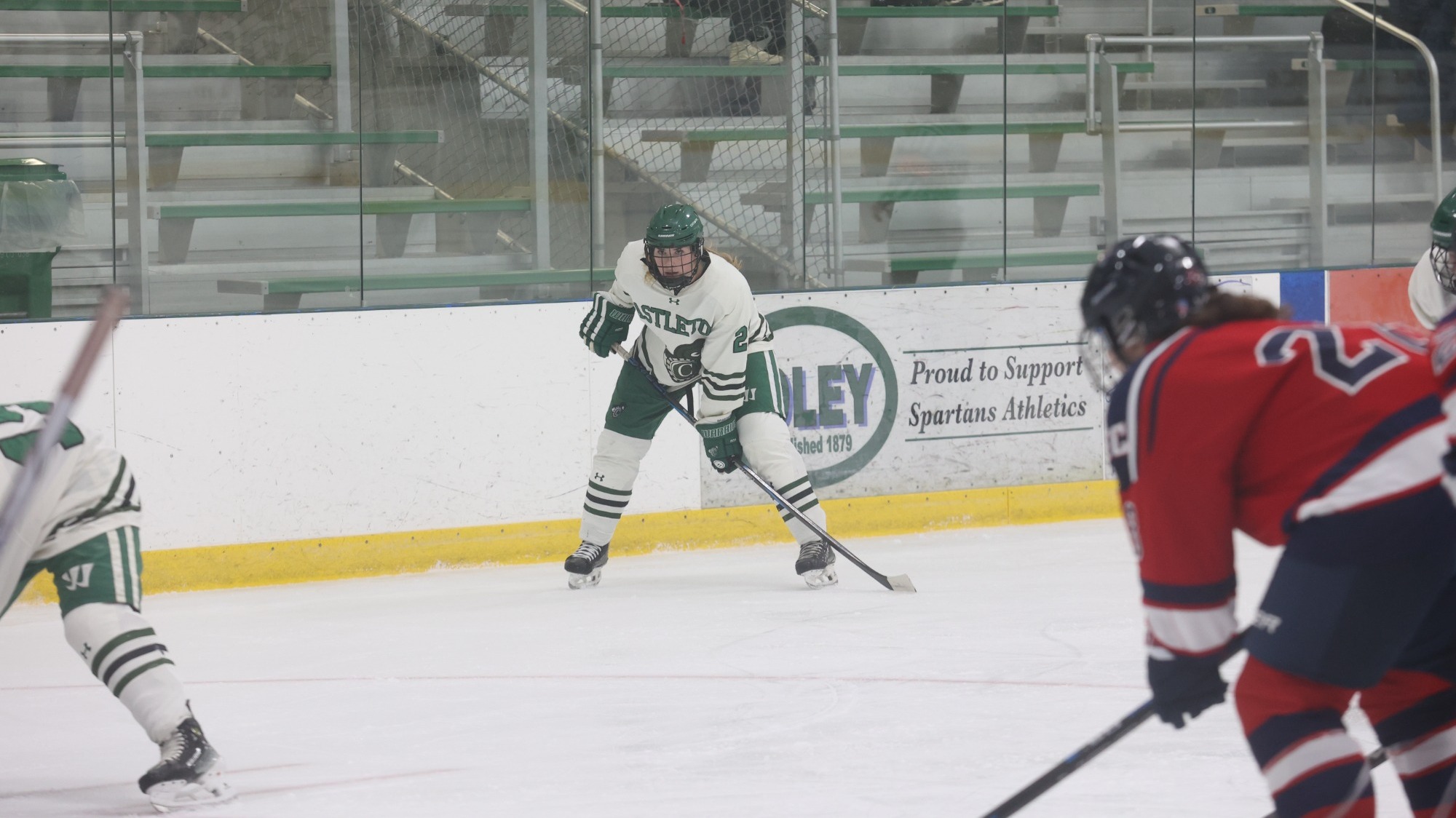 Arscott awaits puck drop on faceoff as she stands at the blueline