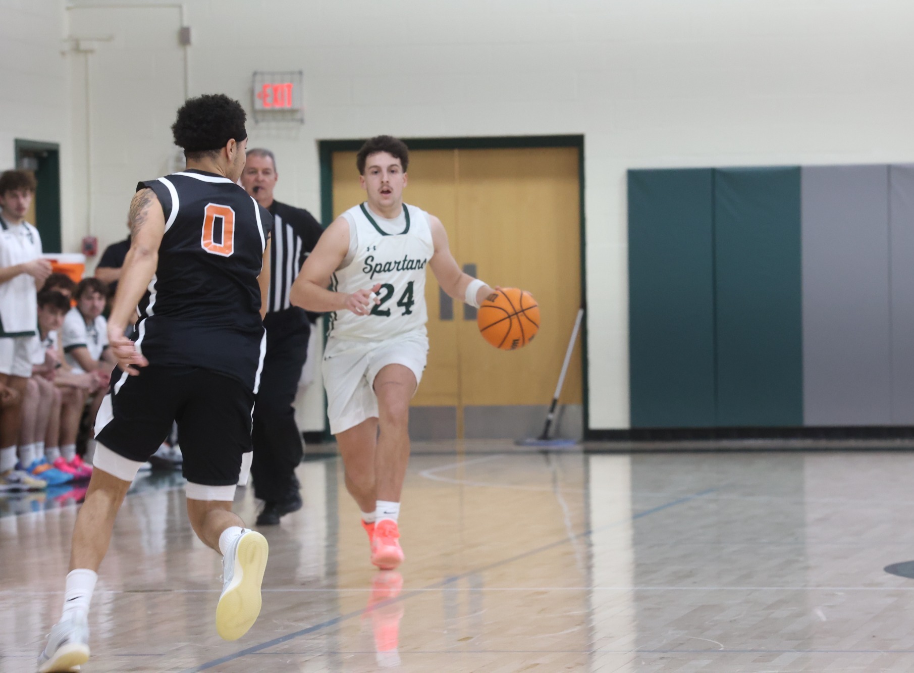 Zach Thompson taking the ball up the court