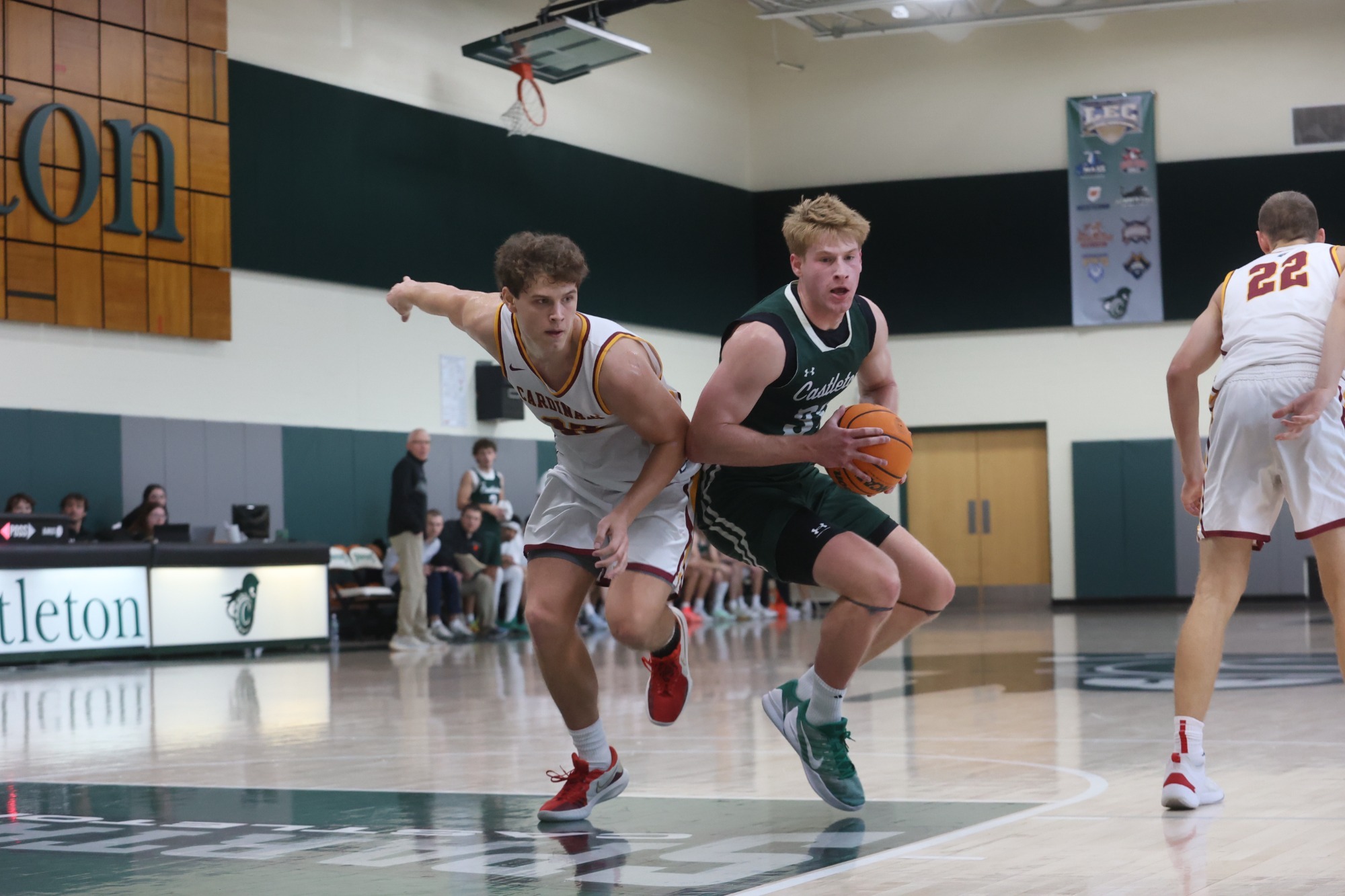 Will Radcliff battles hard with defender as he pushes through the paint