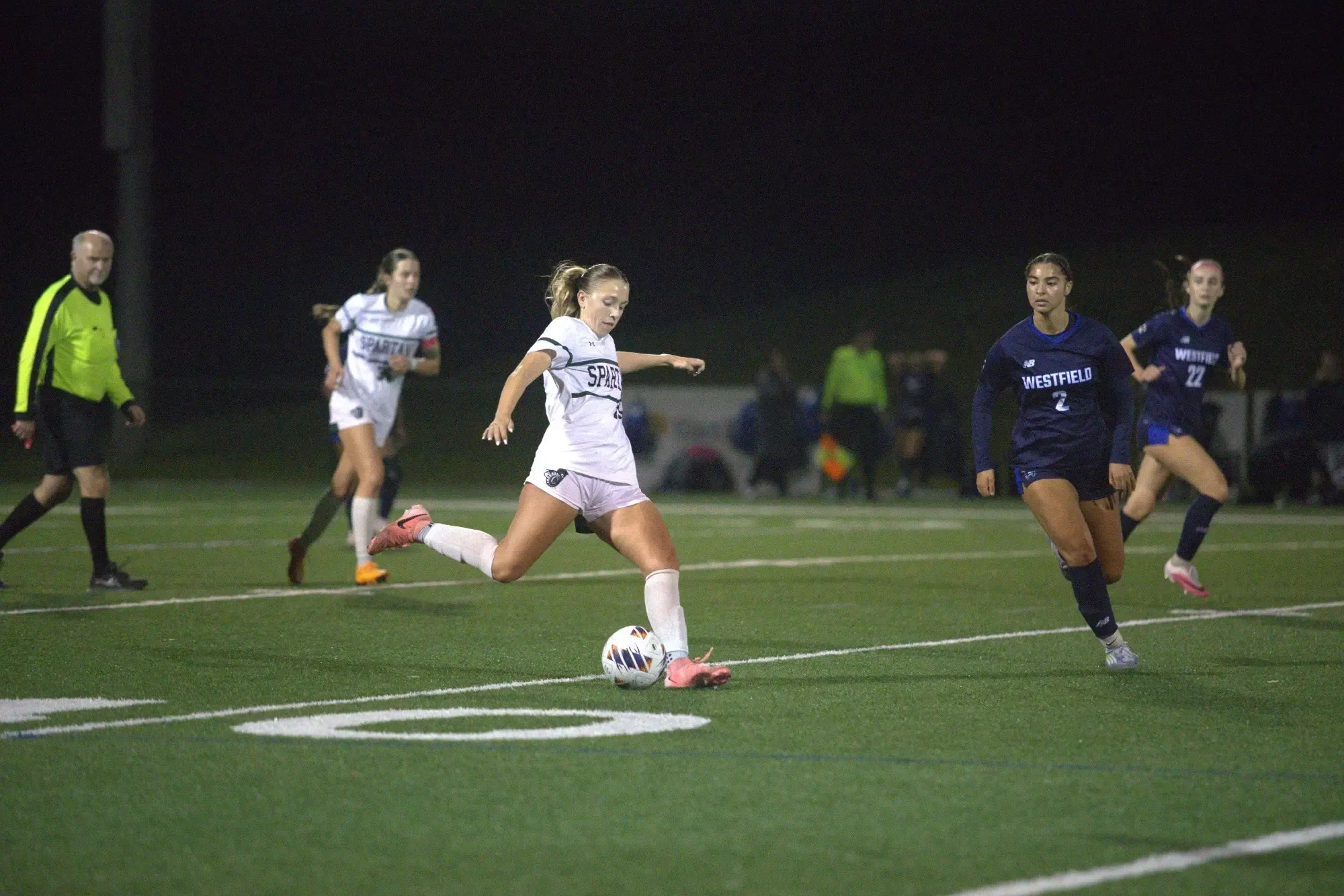 Maya Coviello shooting the ball at the goal