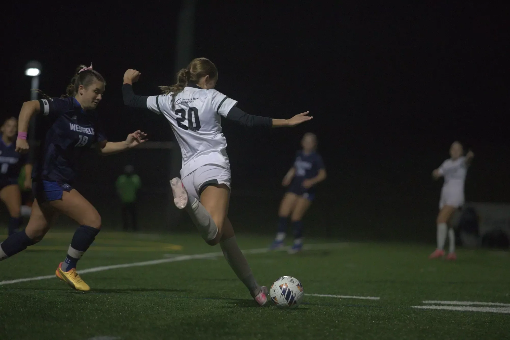 Emma Kirby kicking the ball