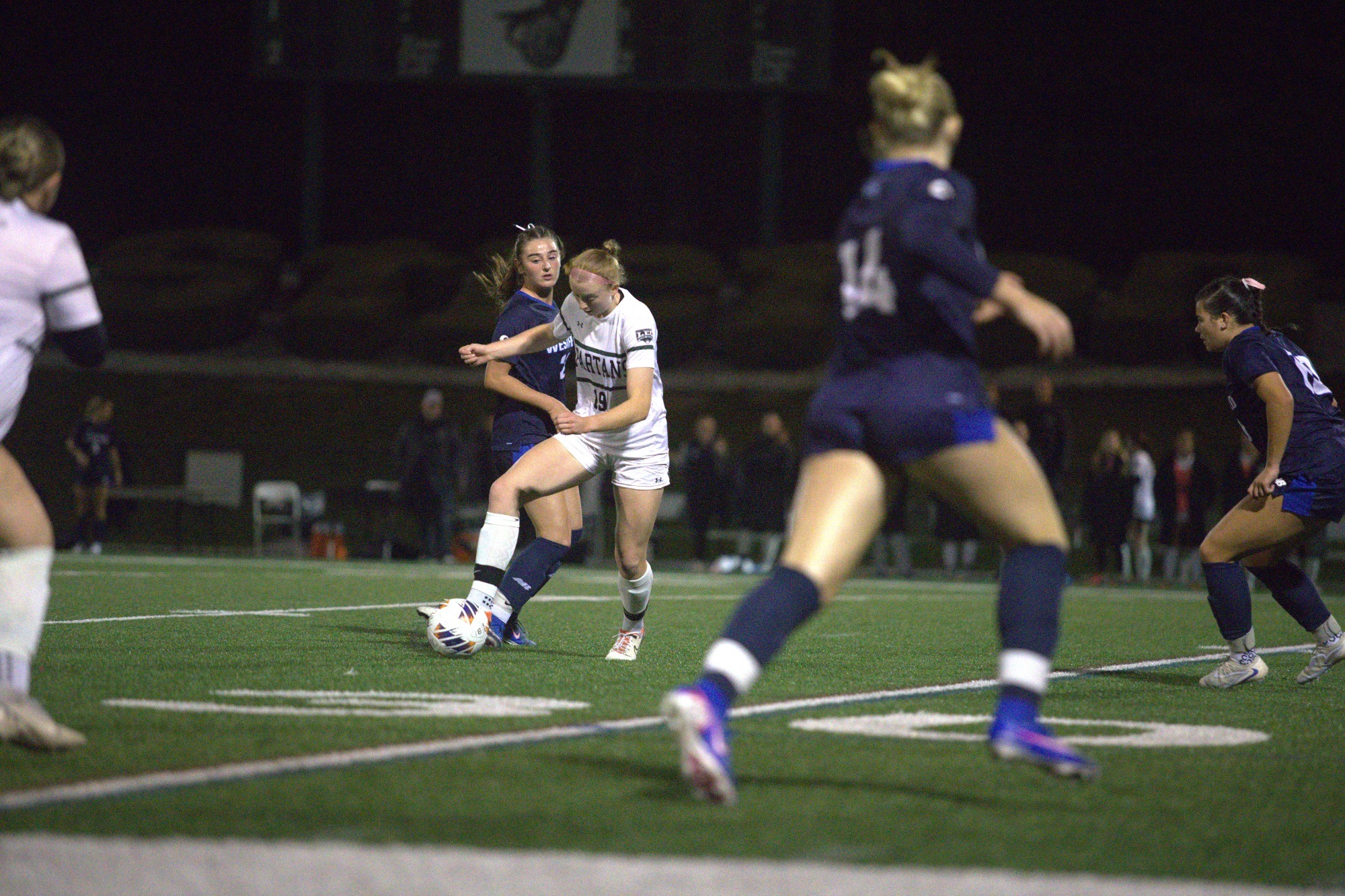 Paige Cargill taking the ball away from a Westfield State Player
