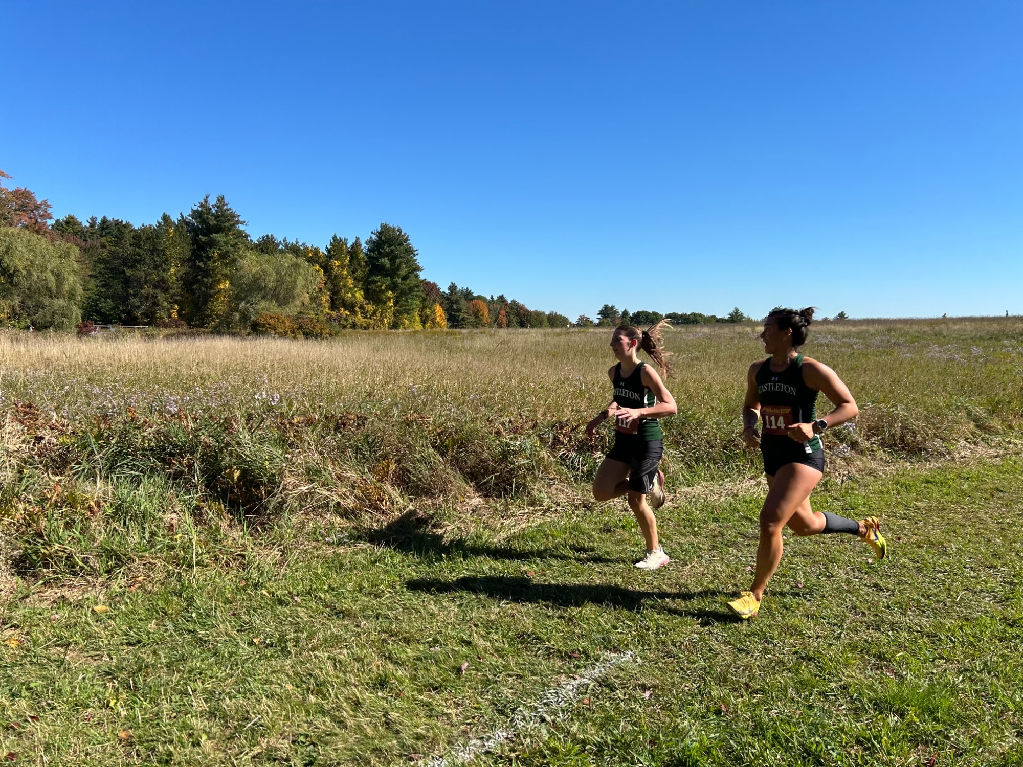 Karsyn Bellomo and Ariana Reynolds running the cross country course