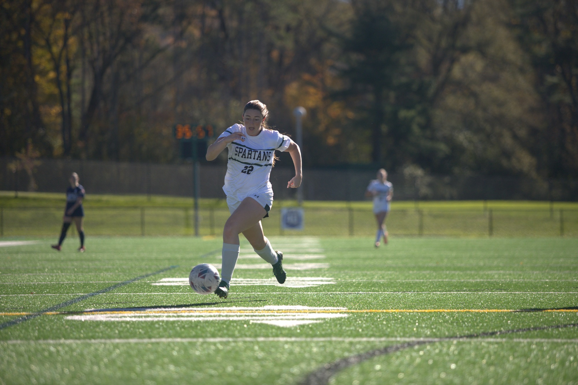 Chloe Green dribbling towards goal