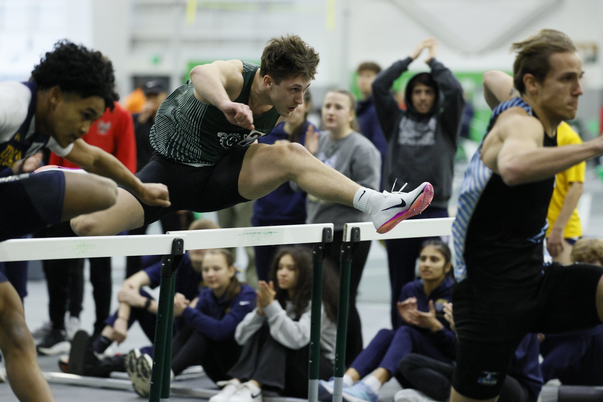 Timothy Pratt leaping over hurdle