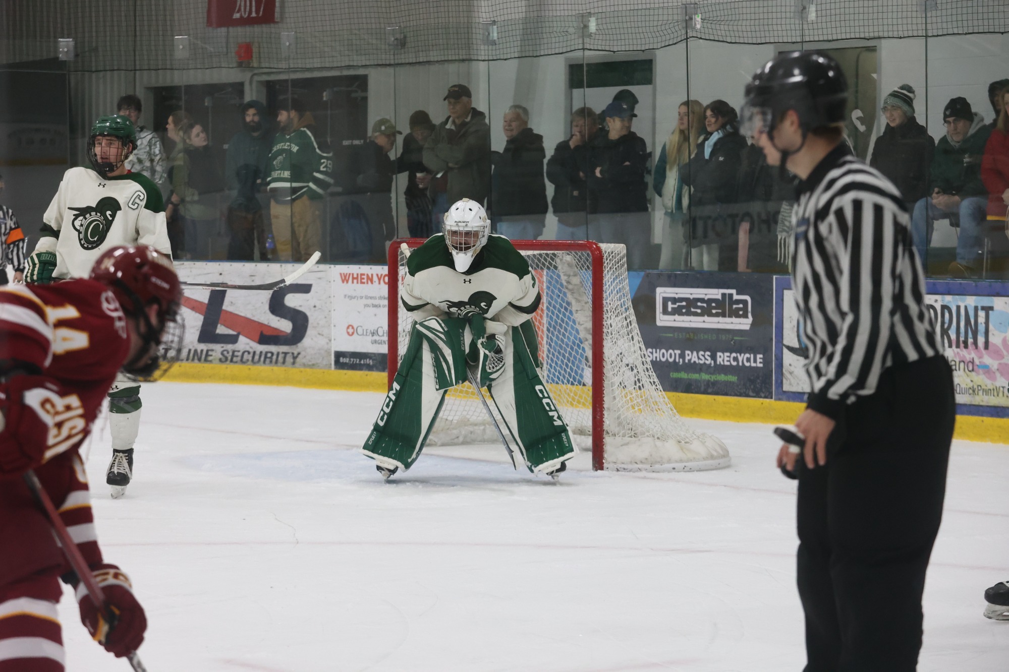 Ward Stand in crease, SJF skater and Cam Reid to his left