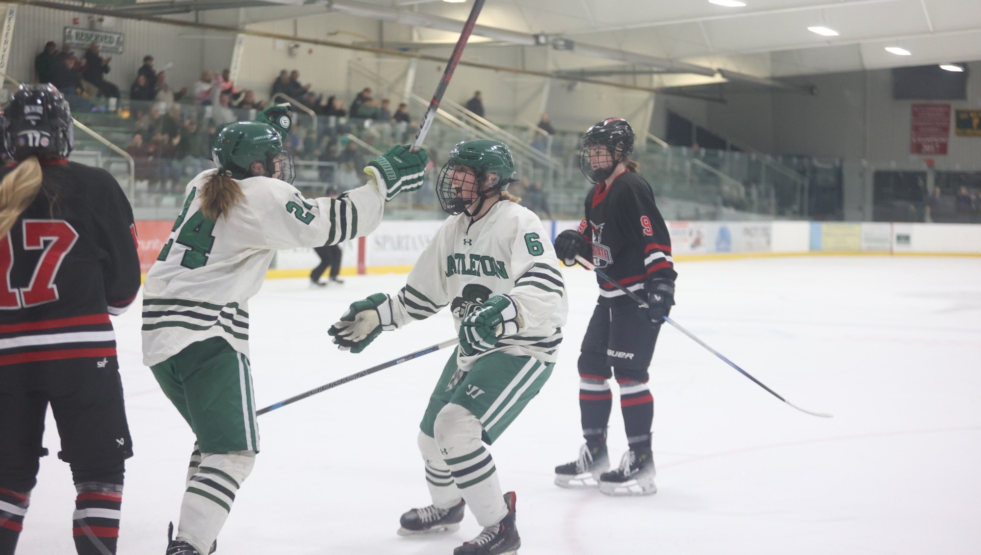 Noble (L) and Jorgenson (R) hug in celebration of Jorgenson goal against Keene State