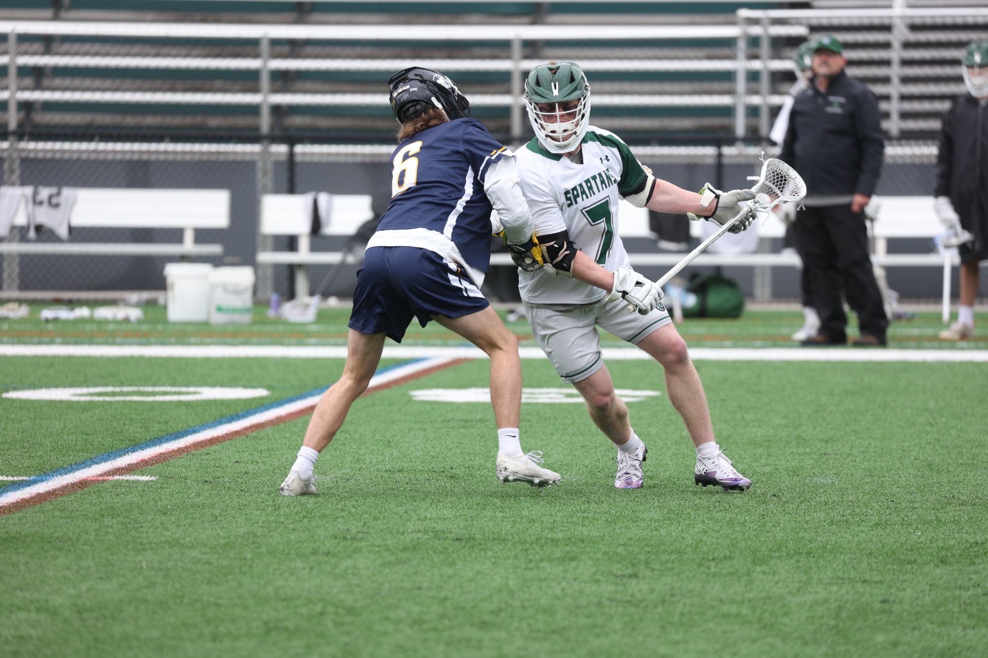 Carter Frankenhoff (R) battles defender (L)