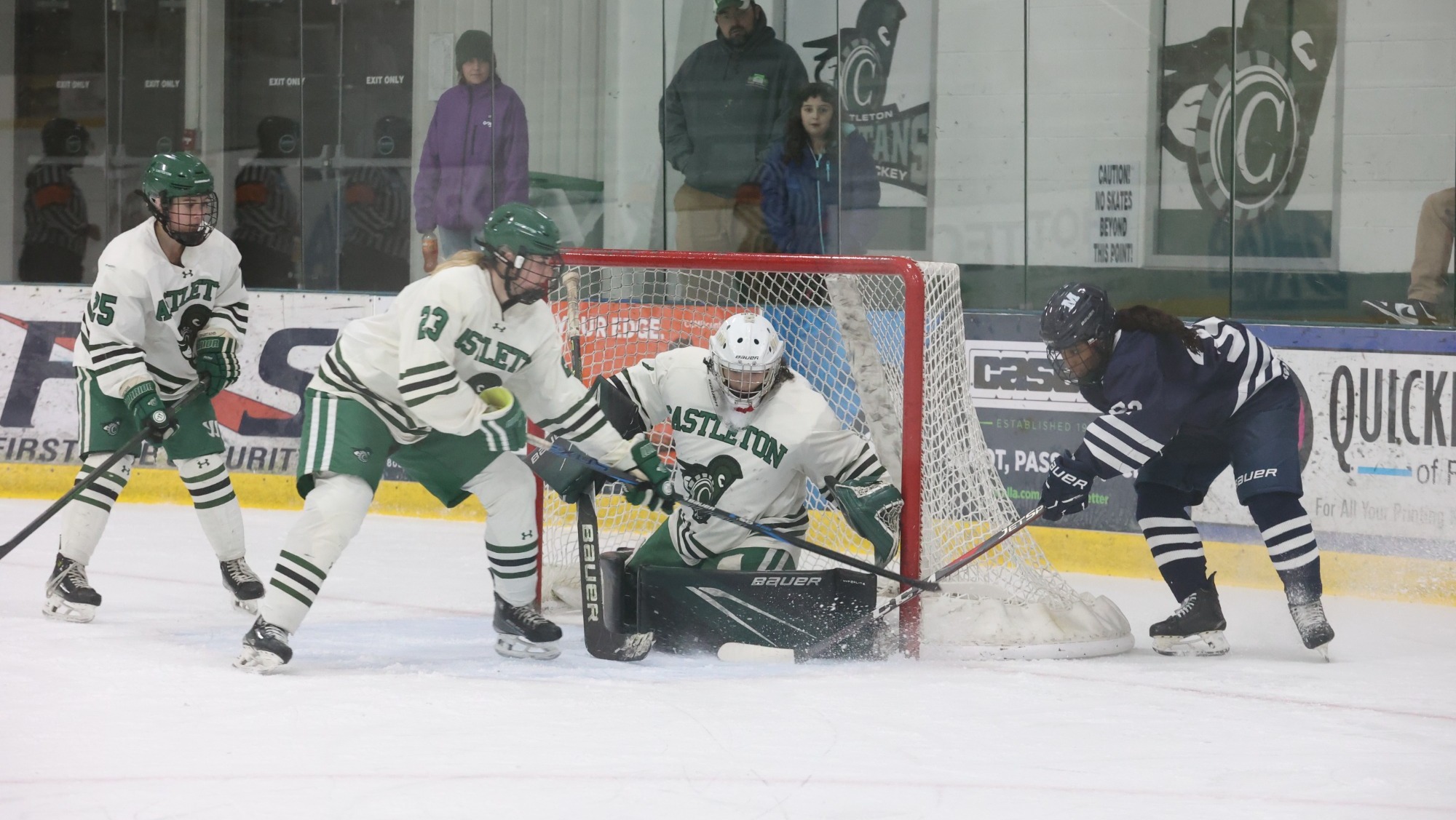 Crowded Spartans crease with Gianna McCusker in goal