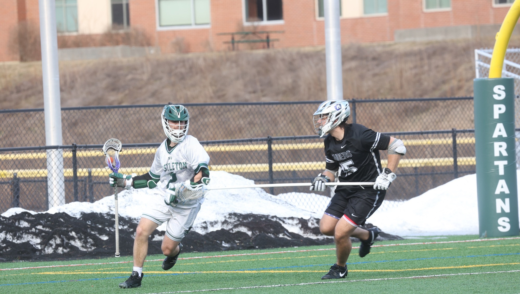 Kozlowski works against Rivier Defense