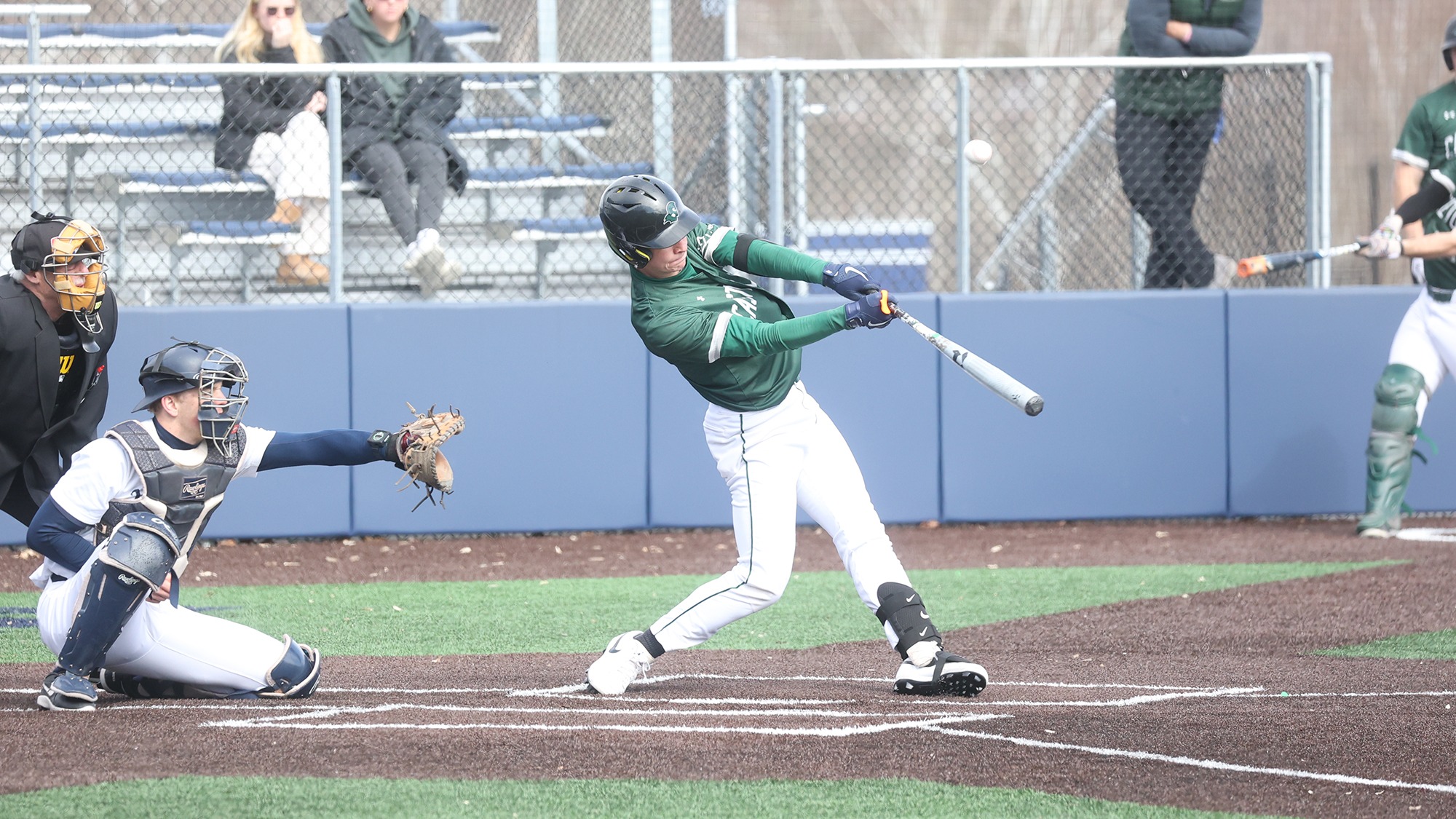Tommie Shaw hitting the ball at Middlebury