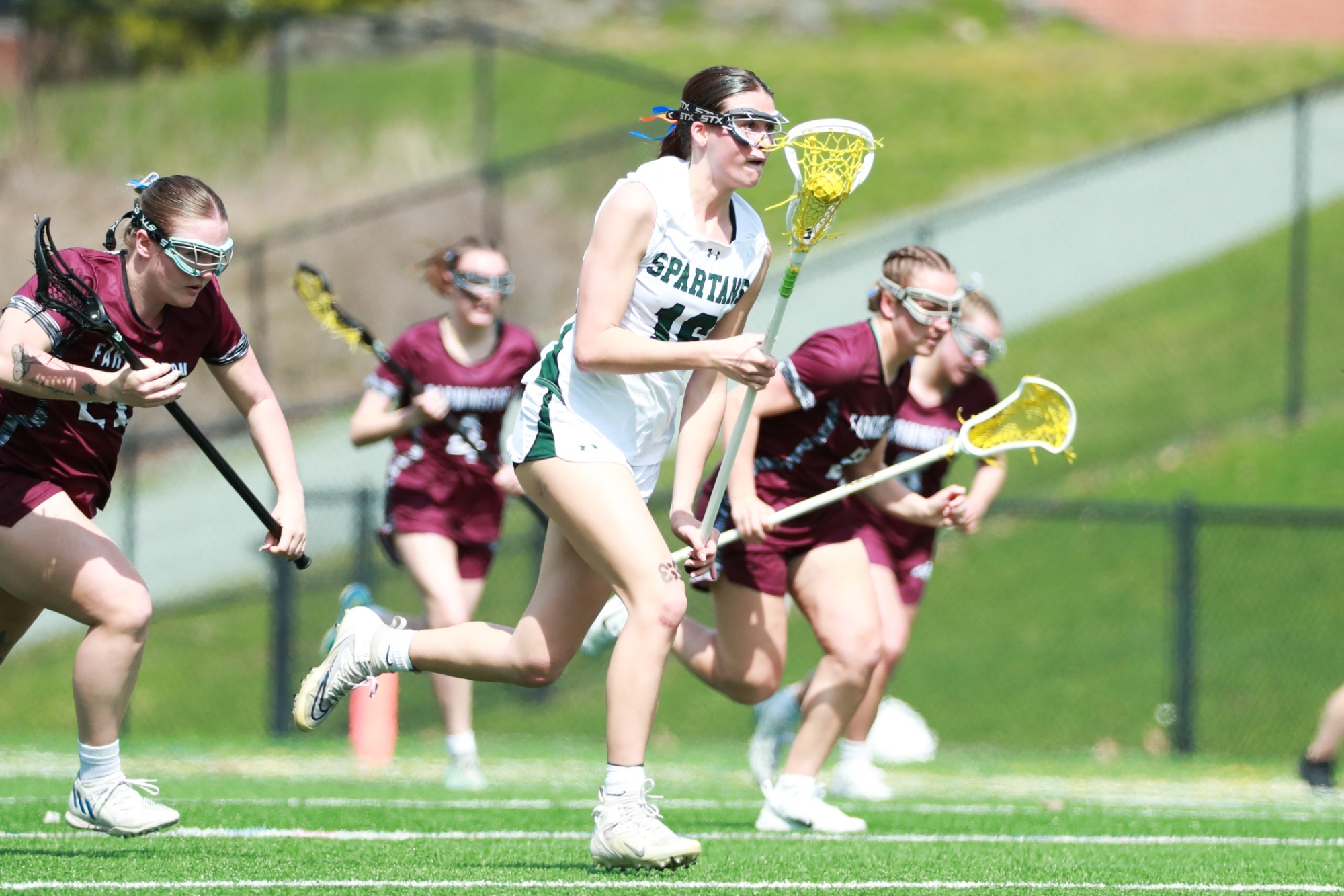 Lanza Bellomo being chased by host of Farmington players