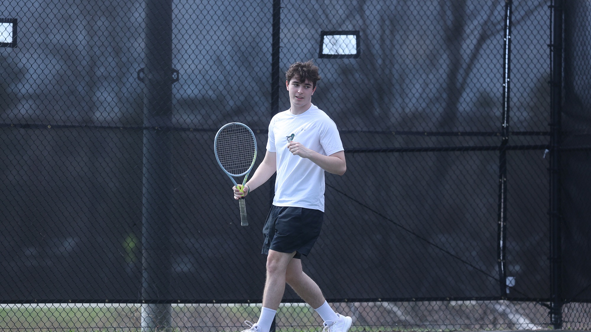 Jackson Paquin walking back smiling after a return
