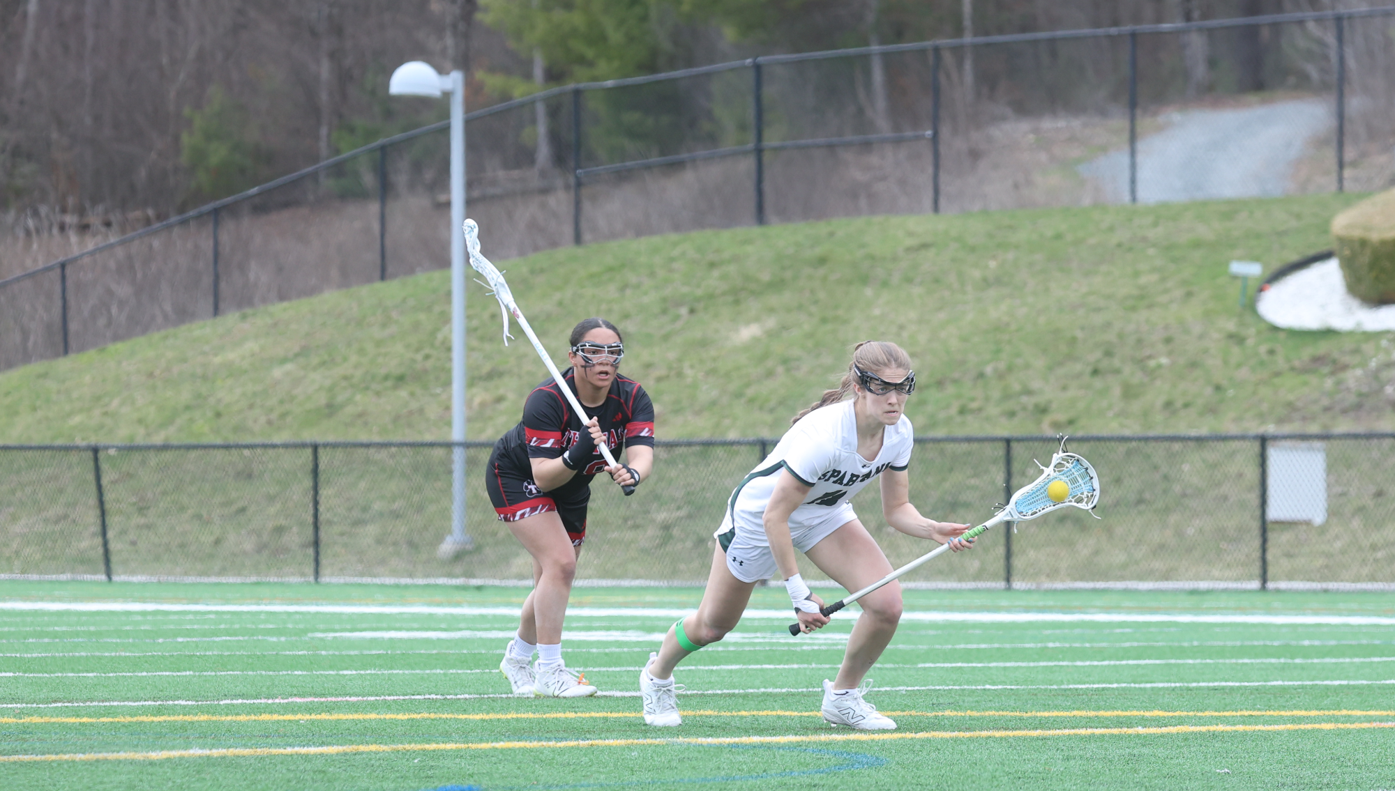 Megan Culp prepares for free-position shot with defender looming in the background.