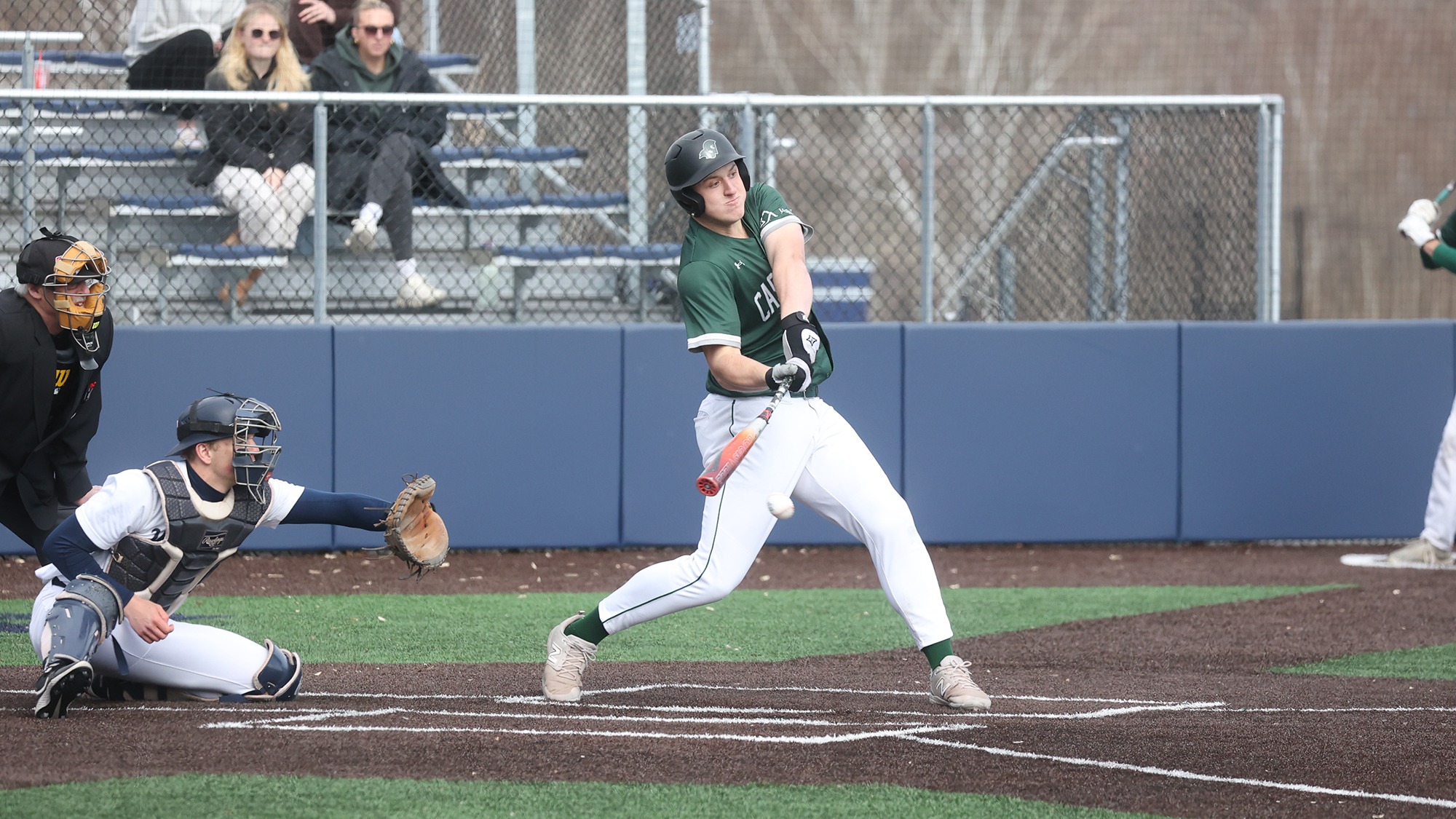 Justin Strozyk hitting the ball against East Conn