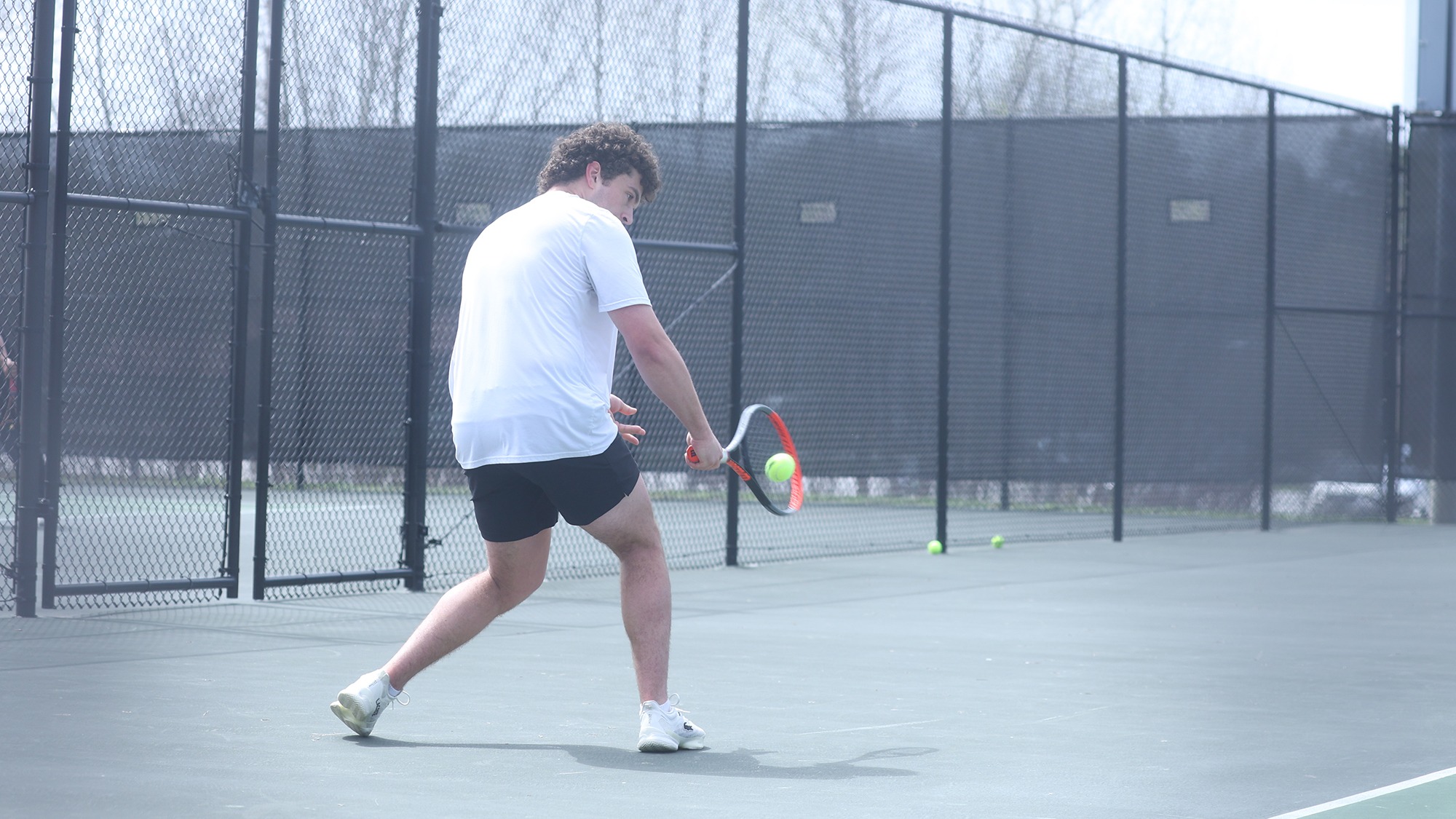 Charles Watson returning a back-handed shot