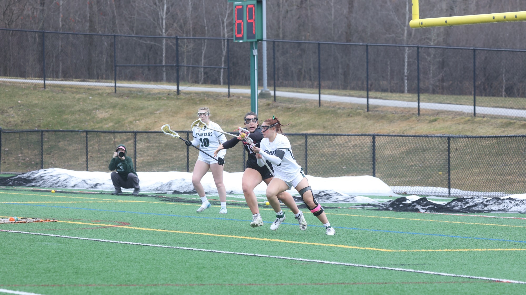 Renny Cota battles with a defender, Taylor Tallmadge looks on