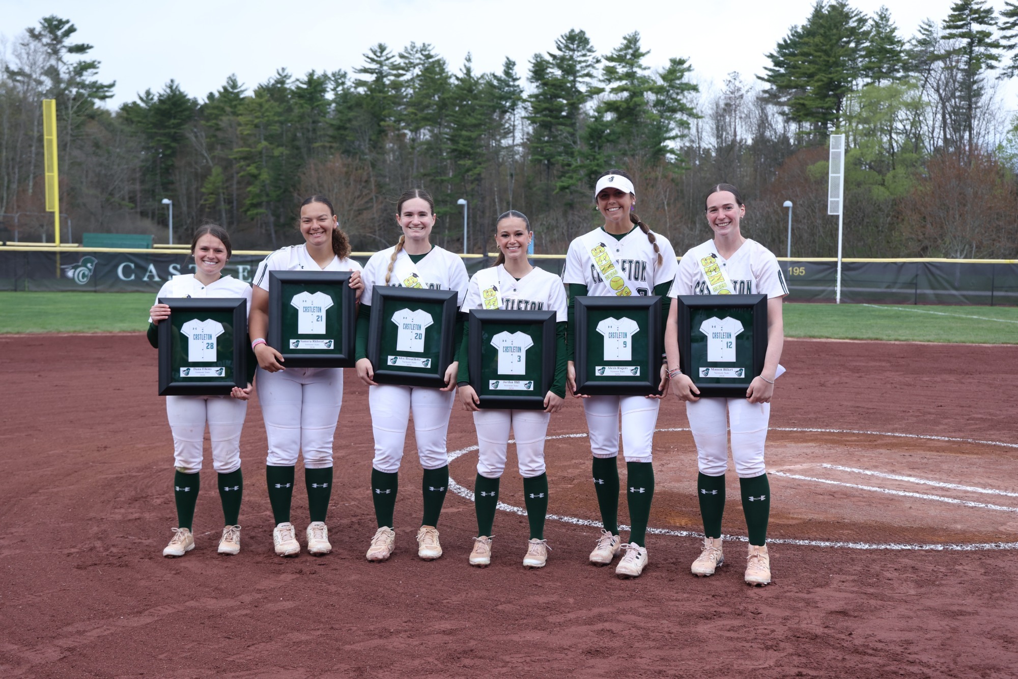 Castleton Softball 2026 seniors with their posters by the mound