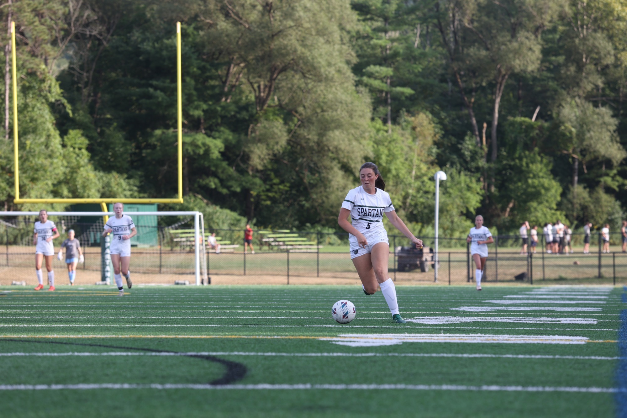 Chloe Green dribbling the ball down the field