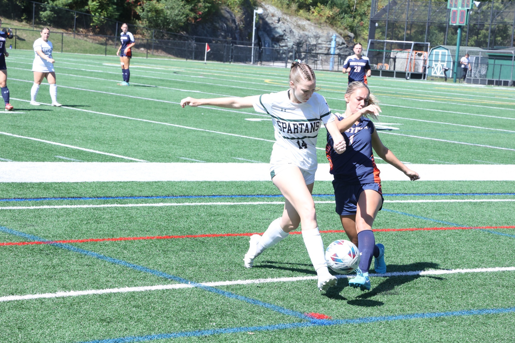 Caitlin Flaherty defending the ball against West Conn
