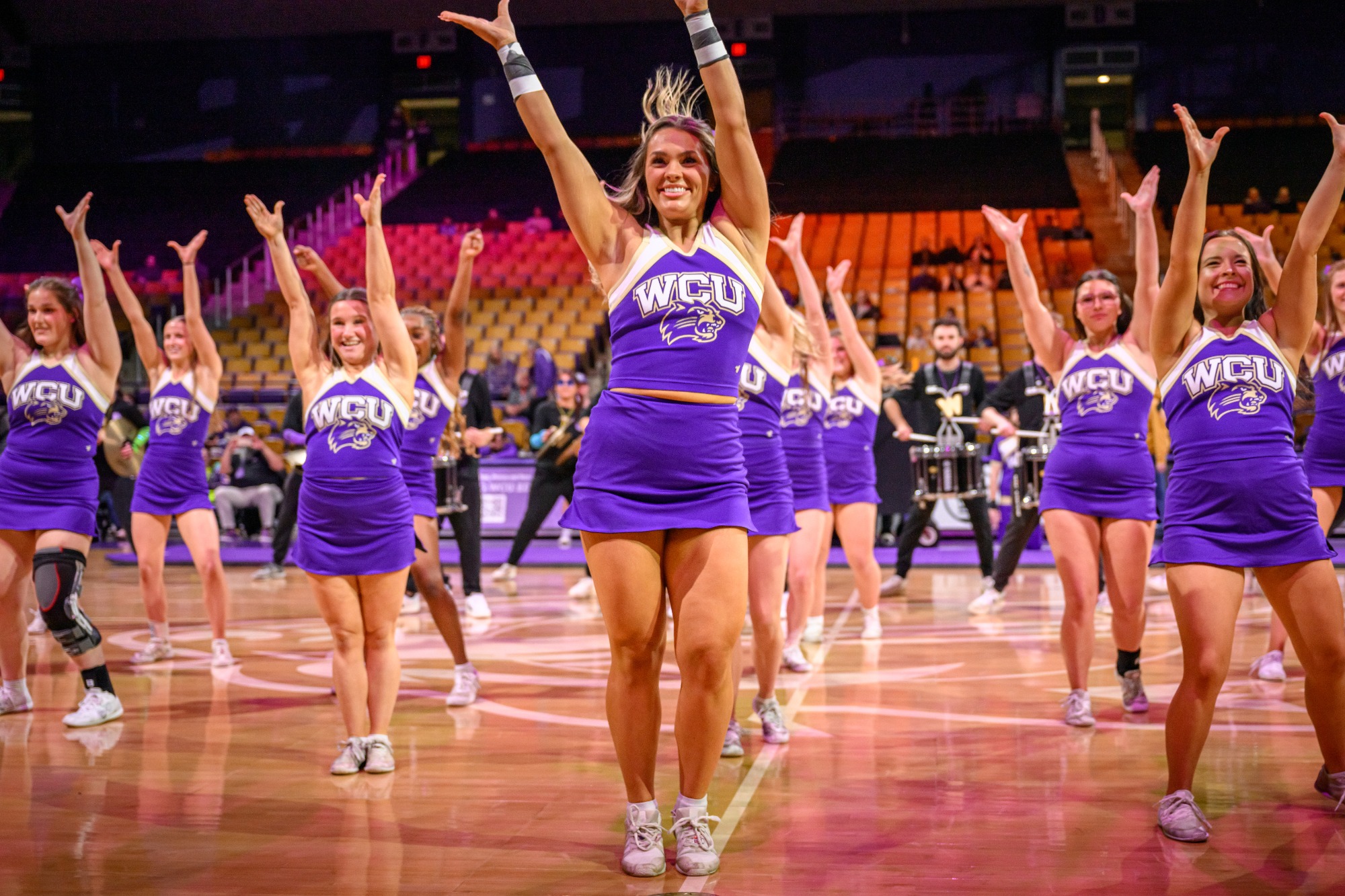 Catamount cheerleaders performing during the Purple Thunder halftime show.