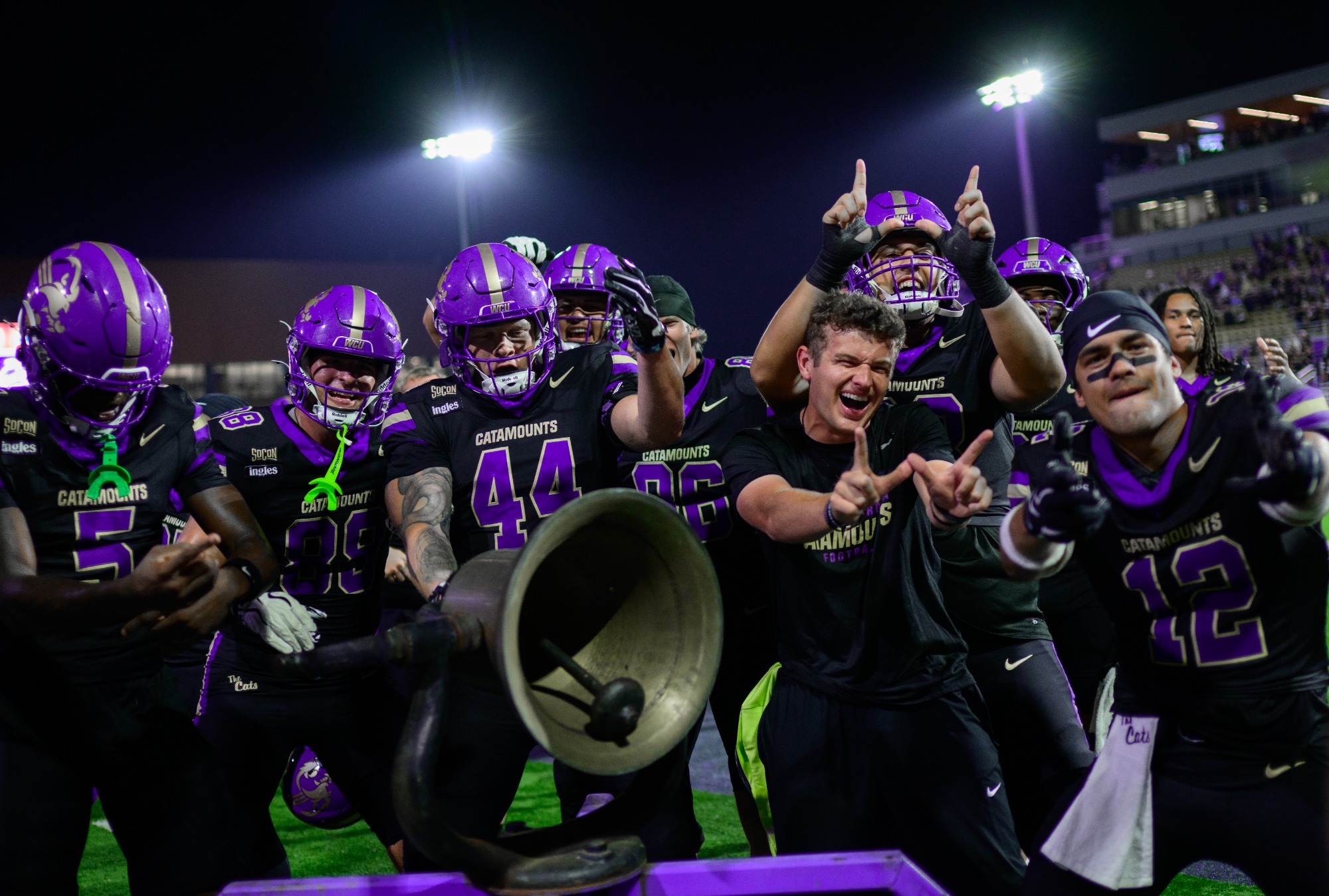 The Catamounts celebrate their season-opening win by ringing the Victory Bell following Saturday's 45-21 win.
