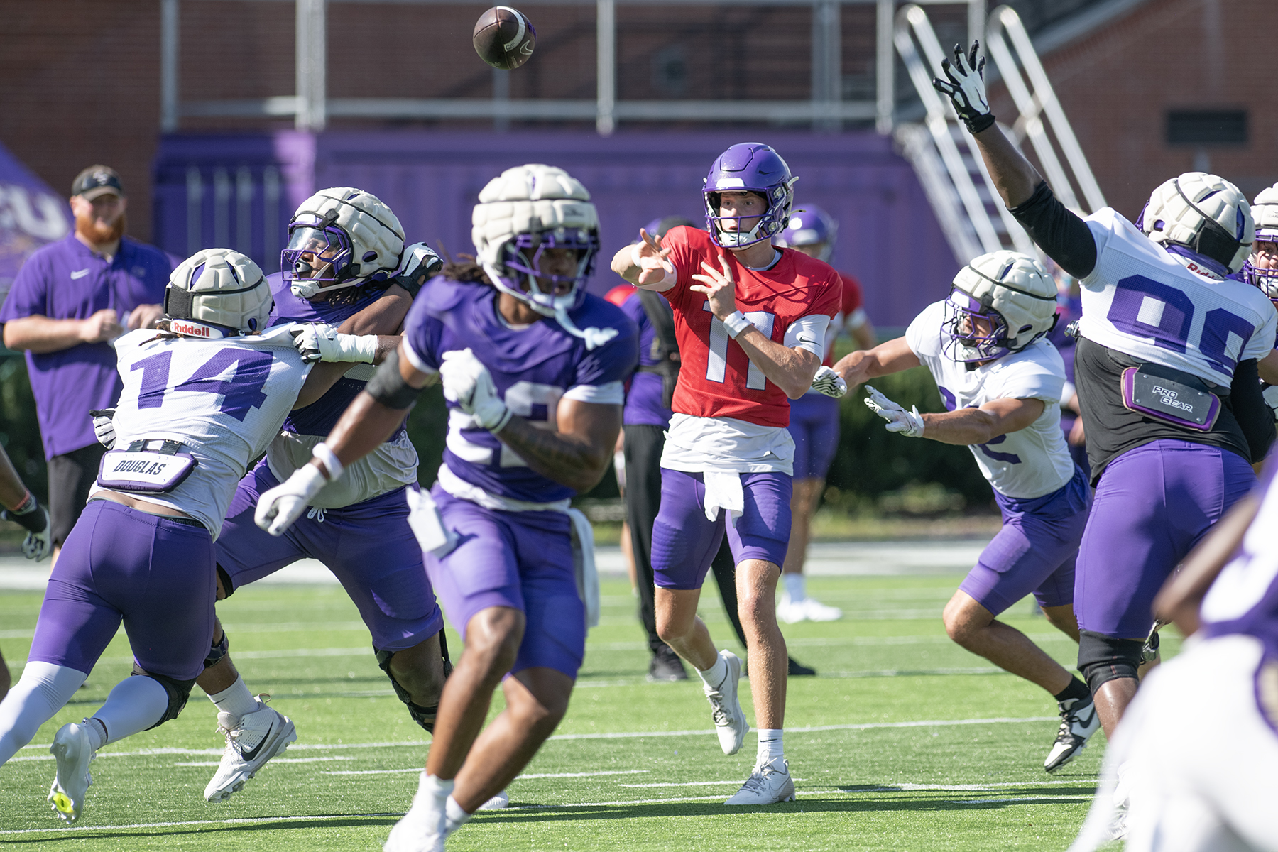 Quarterback Isaac Lee guiding the offense during Saturday's first preseason scrimmage in Cullowhee.