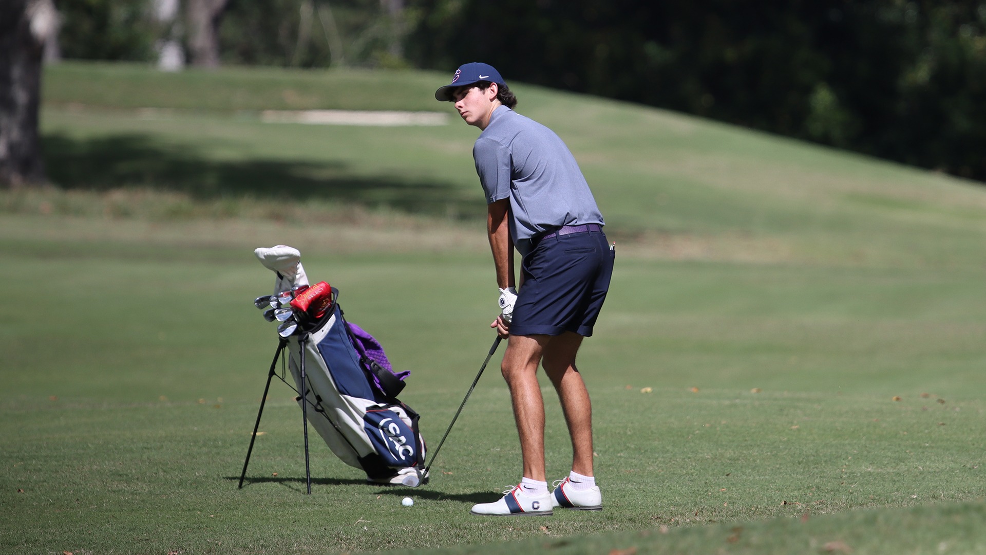 Connor Carter lines up a shot from the fairway