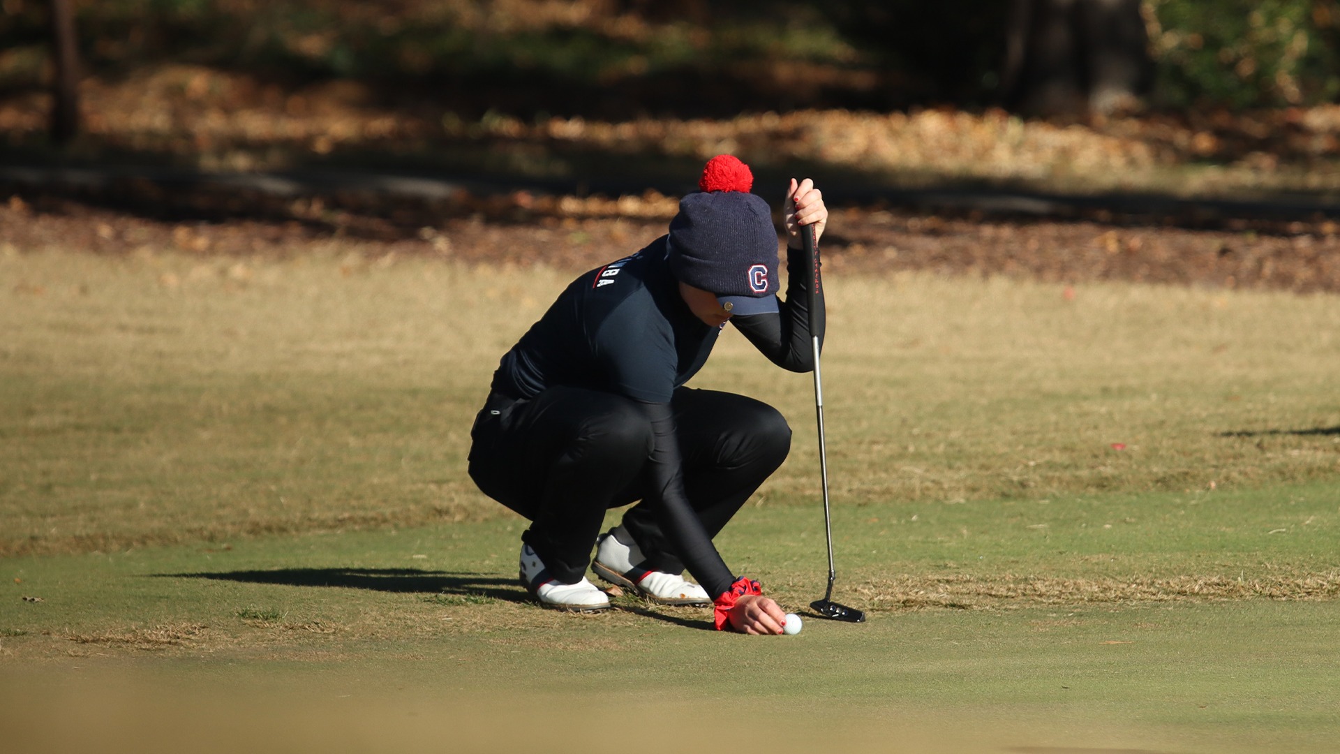 Rachel Carlson lining up a putt at the UNCG Collegiate