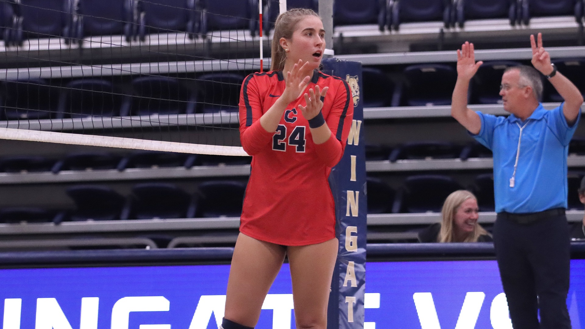 Annica Kagle clapping with teammates at Wingate