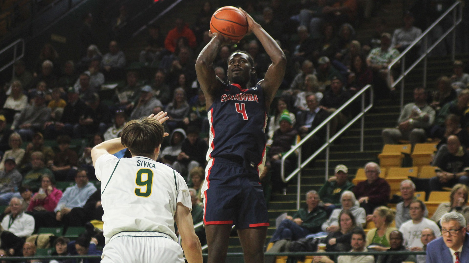 Nick Walker shoots over George Mason's Stas Sivka in Catawba's exhibition at EagleBank Arena in Fairfax, Va.
