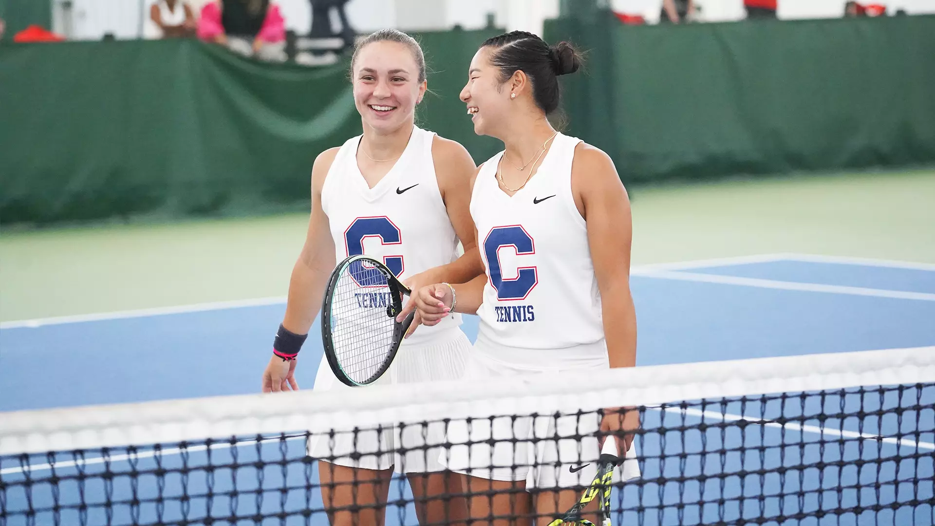 Sofia Antolini and Rin Igarashi chatting after a doubles match