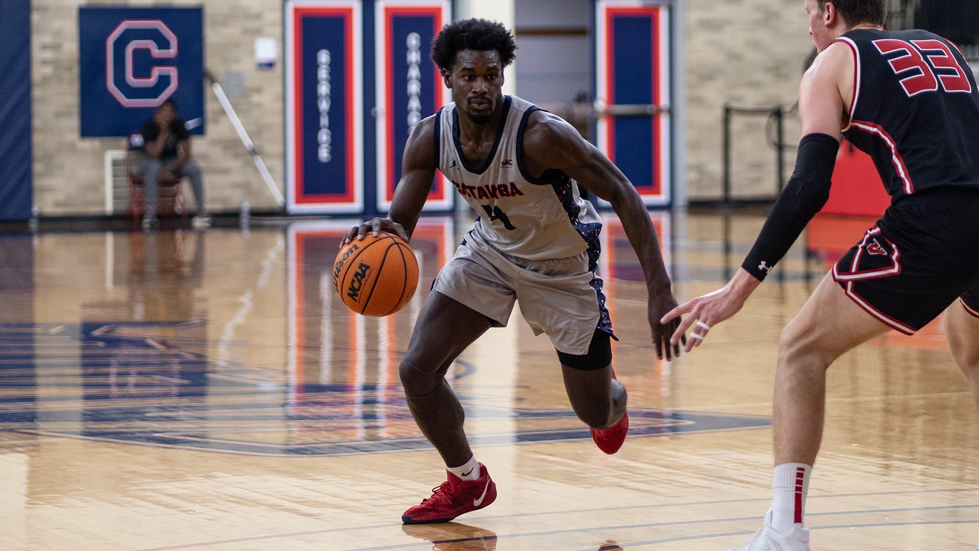 Nick Walker dribbling down the lane against UVA Wise