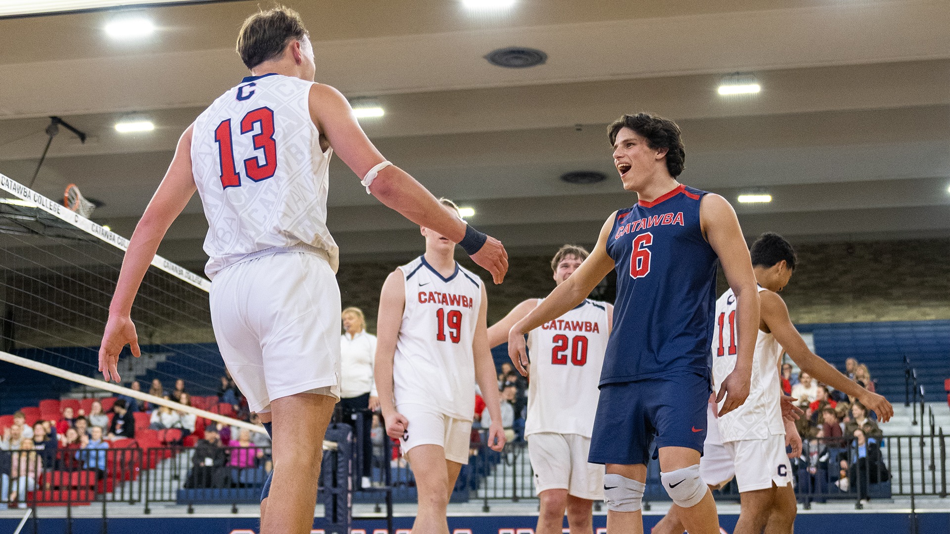 Justin Arrowood and Max Adkisson celebrating a point against Lees-McRae