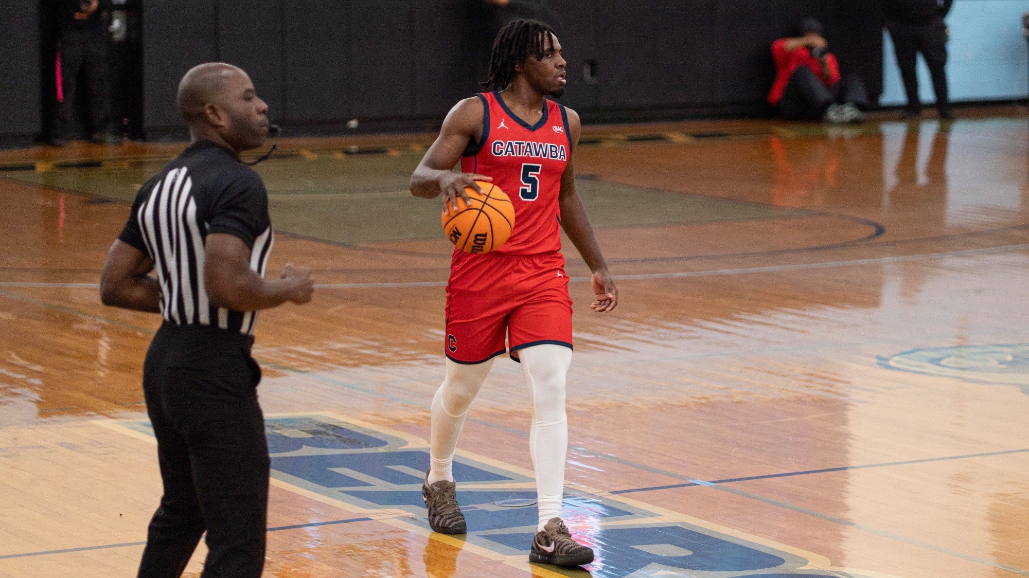 LeVionne Lindsey dribbling up court against Livingstone