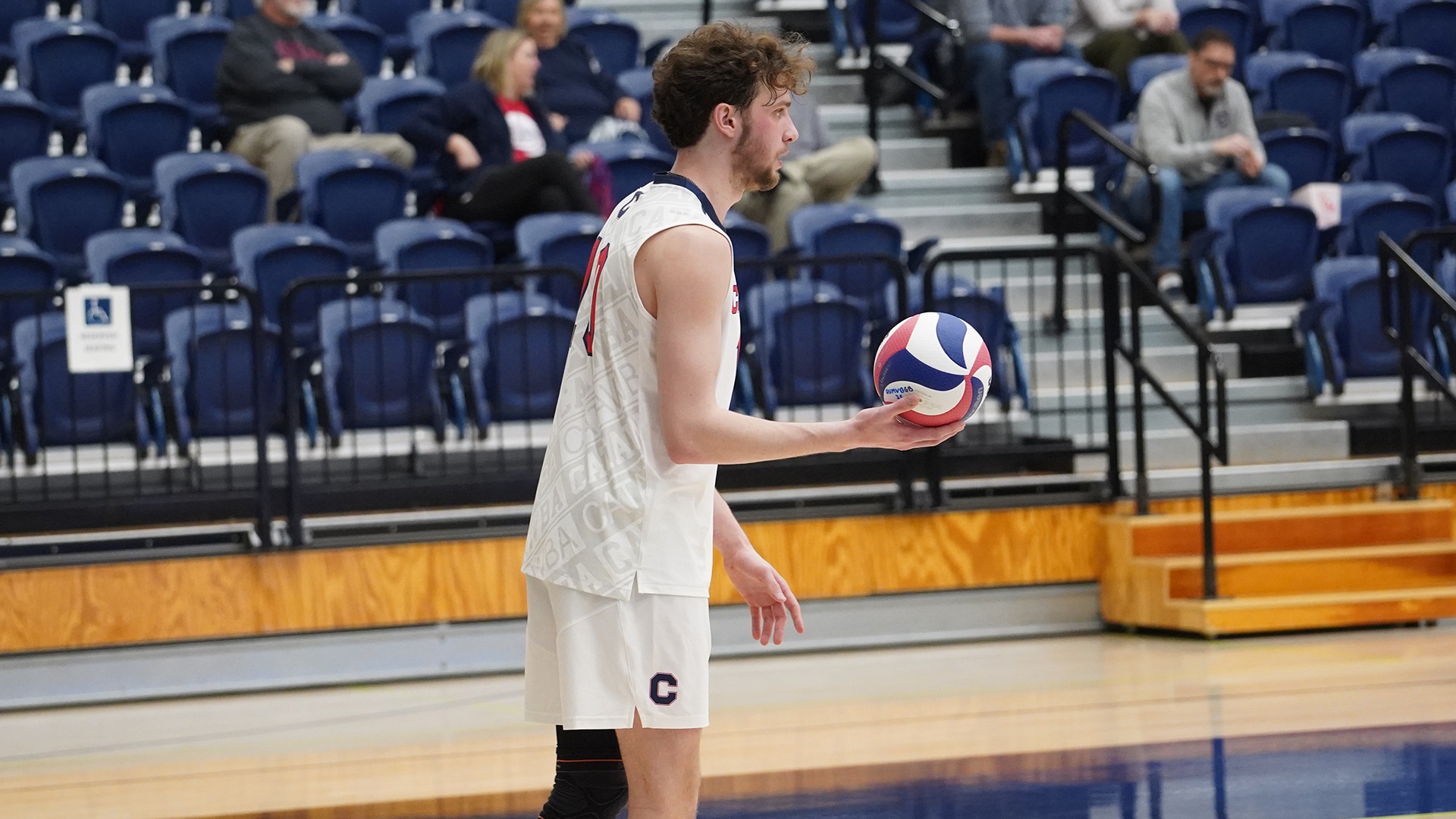 Wyatt Eastin preparing to serve against Queens