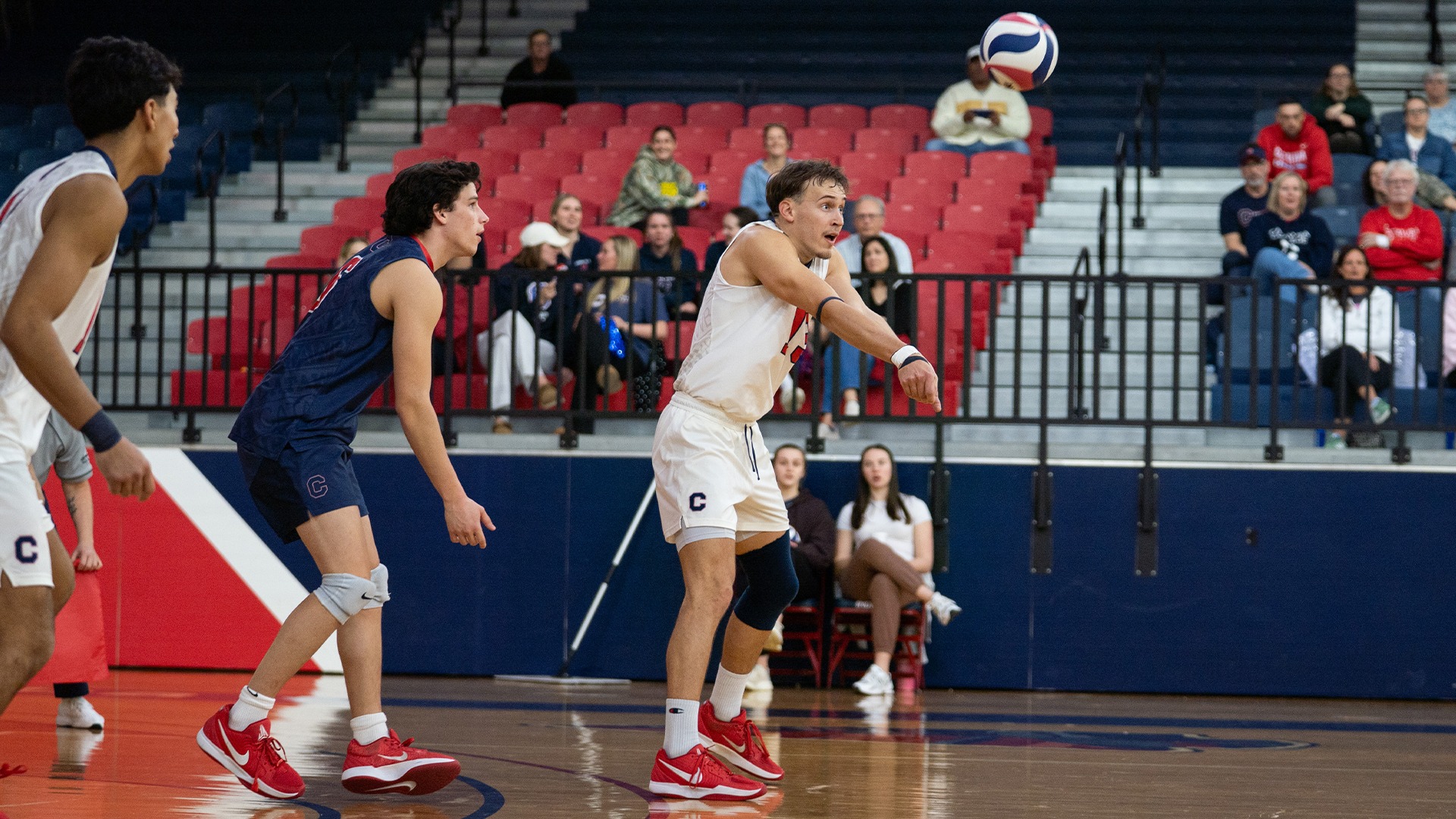Justin Arrowood receiving a serve against Benedict